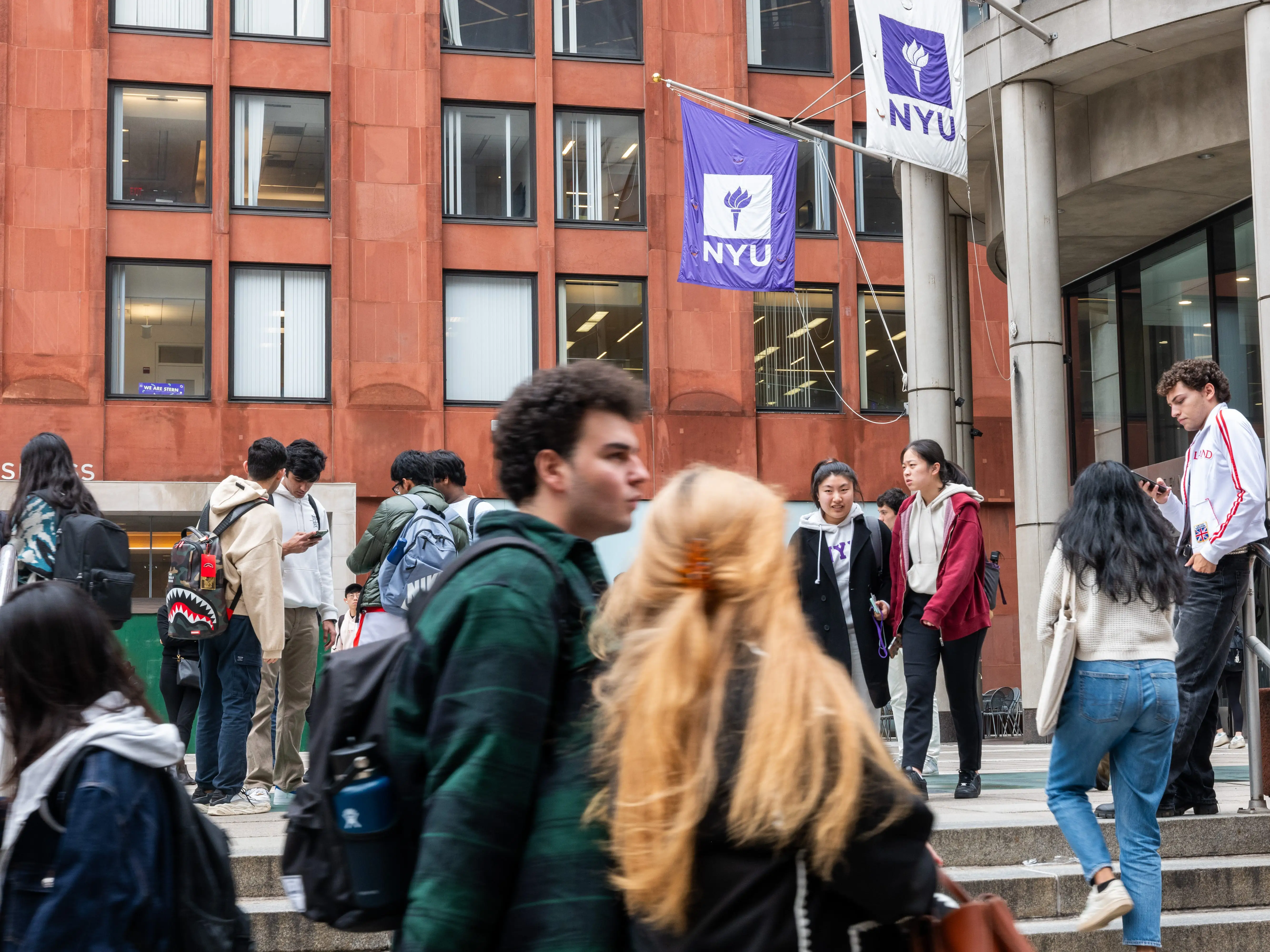 Students walk on a city college campus.