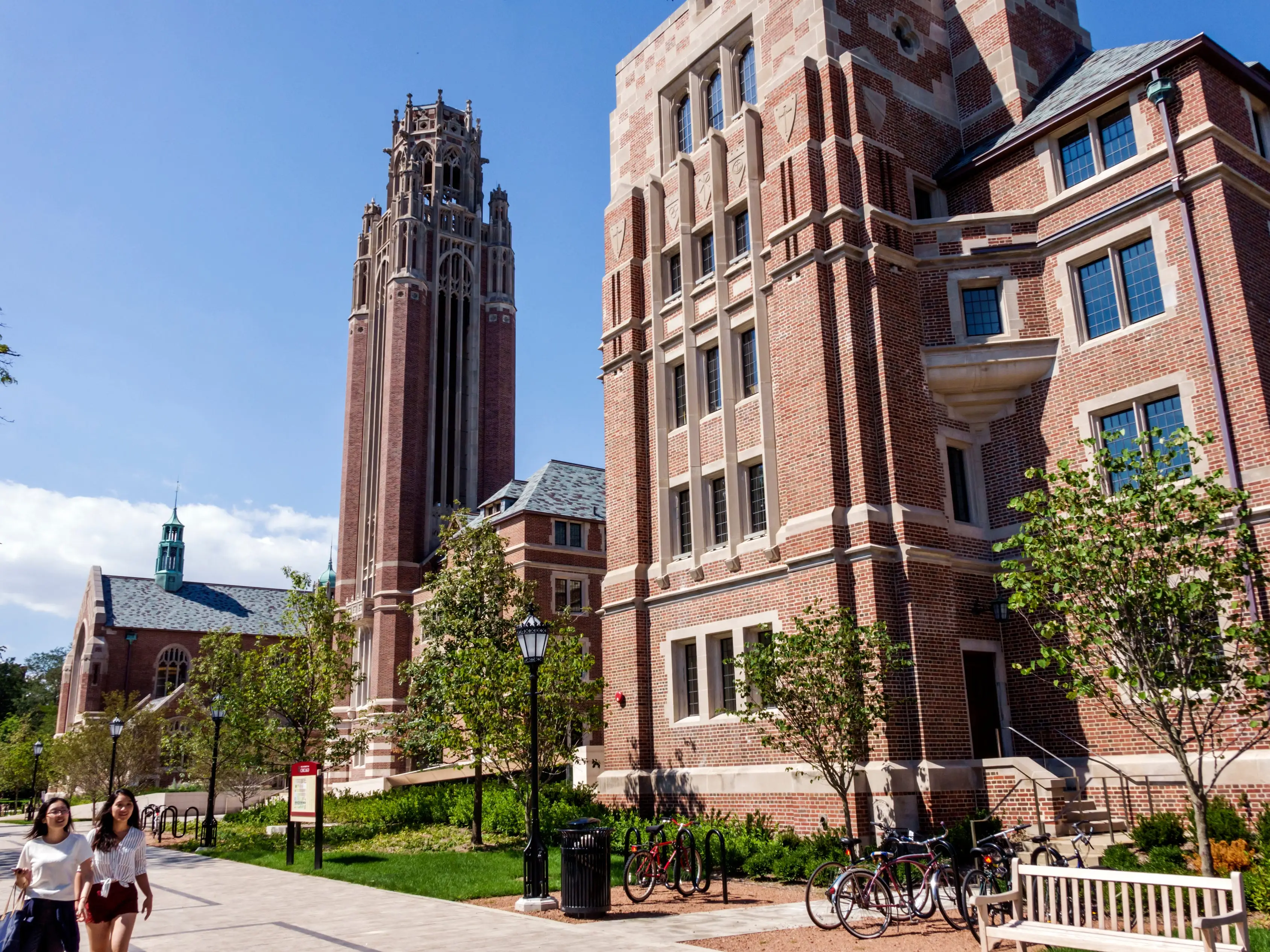 Students walk on a college campus.