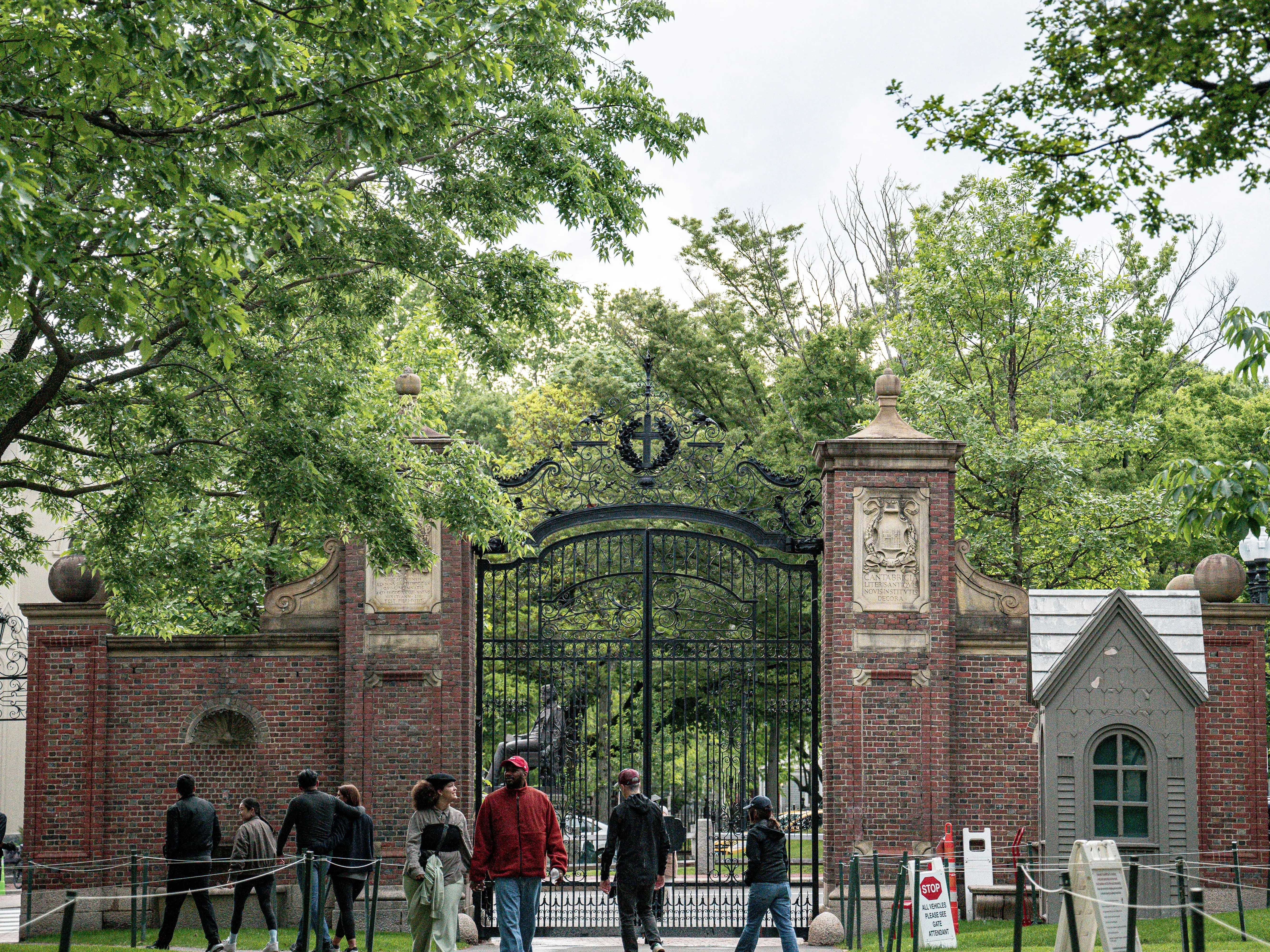 Students walk on a college campus.