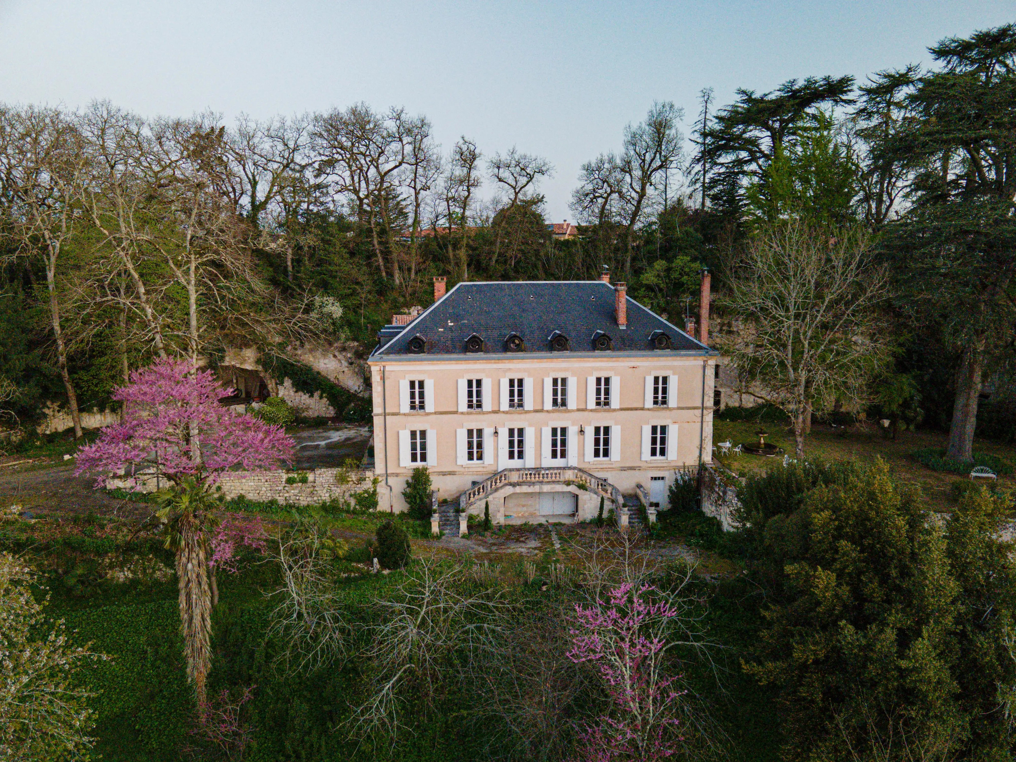 Exterior of chateau with trees surrounding it