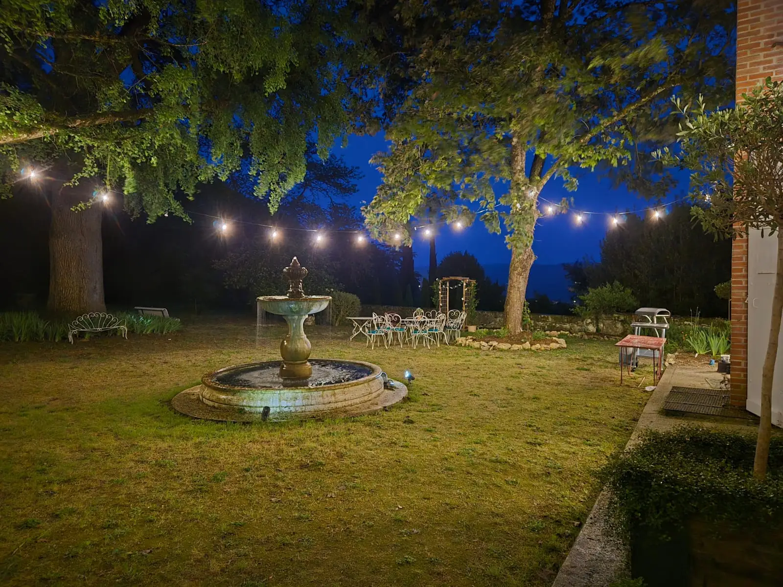 Fountain, outdoor area with lights at night