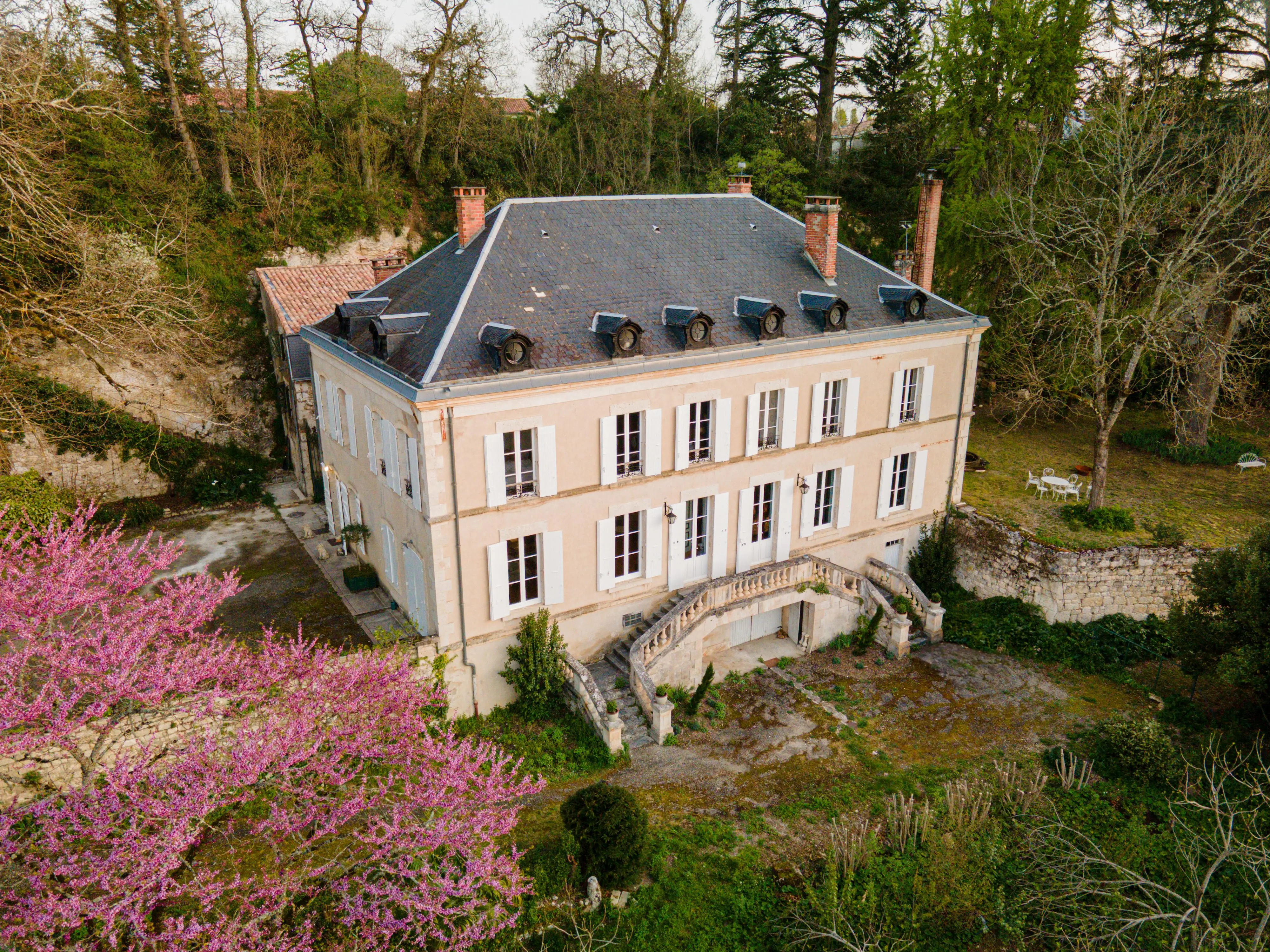 Aerial view of Exterior of chateau with trees surrounding it