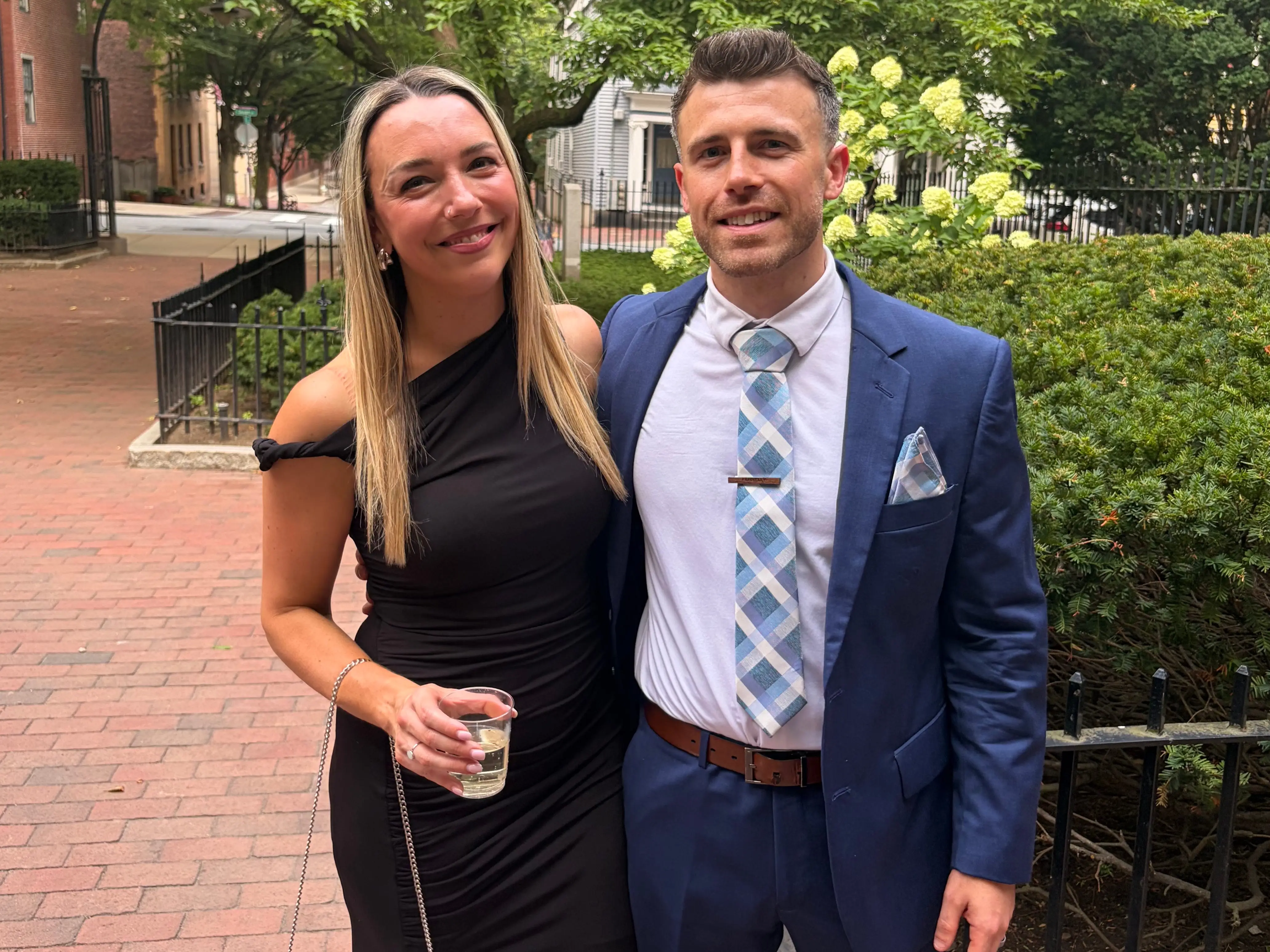 the author and her husband wearing formal-wear and smiling