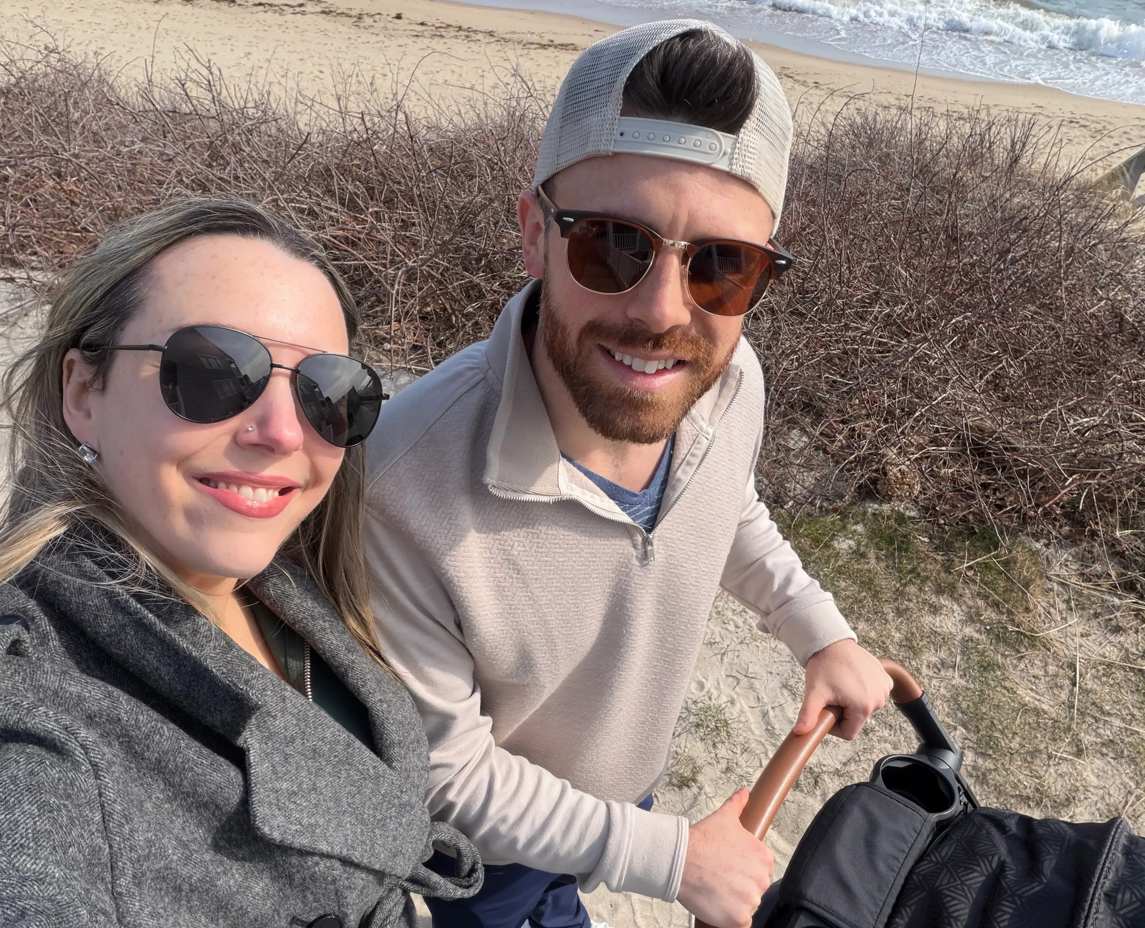 the author and her husband walking on a beach