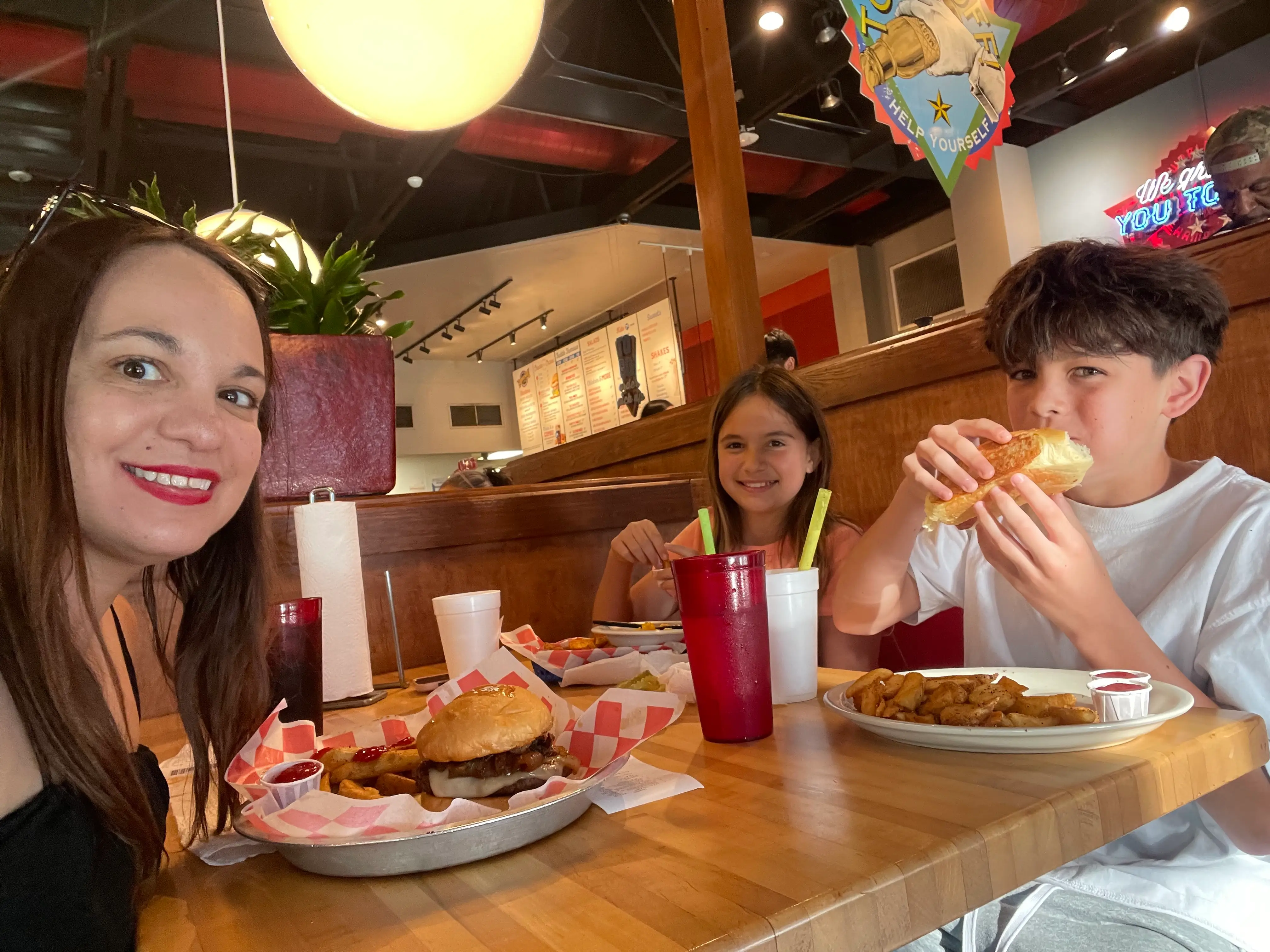 The author and her kids enjoy a meal at a restaurant.