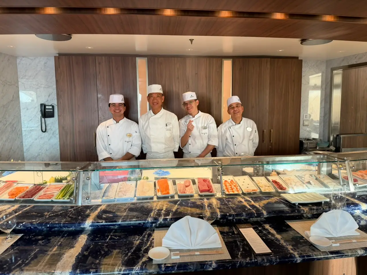 chefs behind platters of fish
