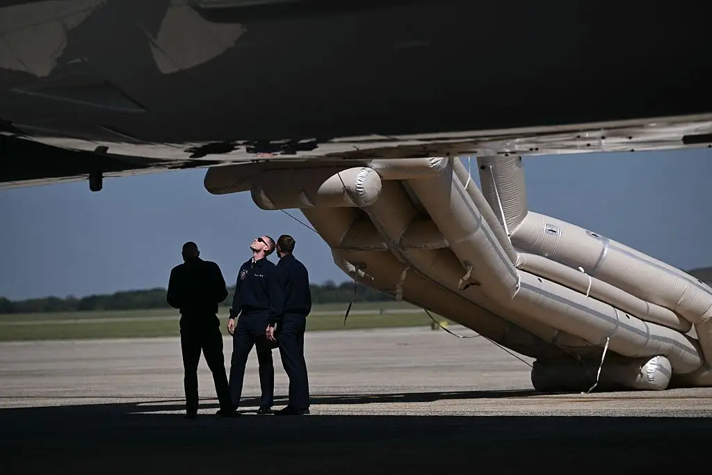 The emergency slide of the new Air Force One was deployed on the tarmac.
