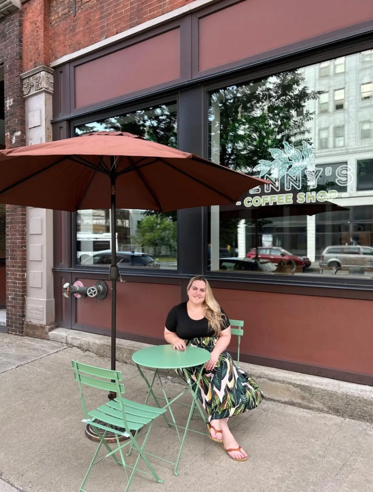 woman sitting art a cafe