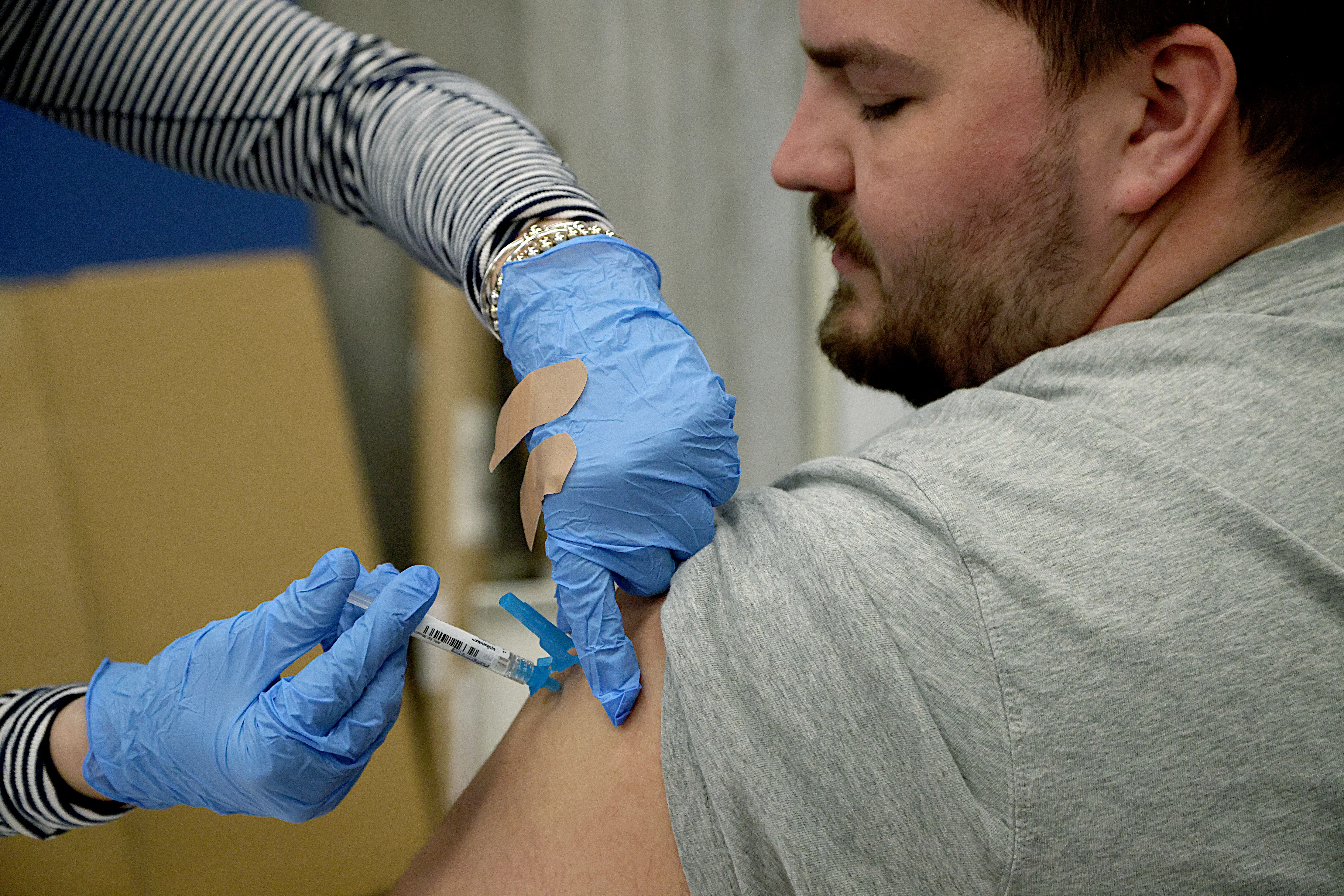 A man receives a shot.