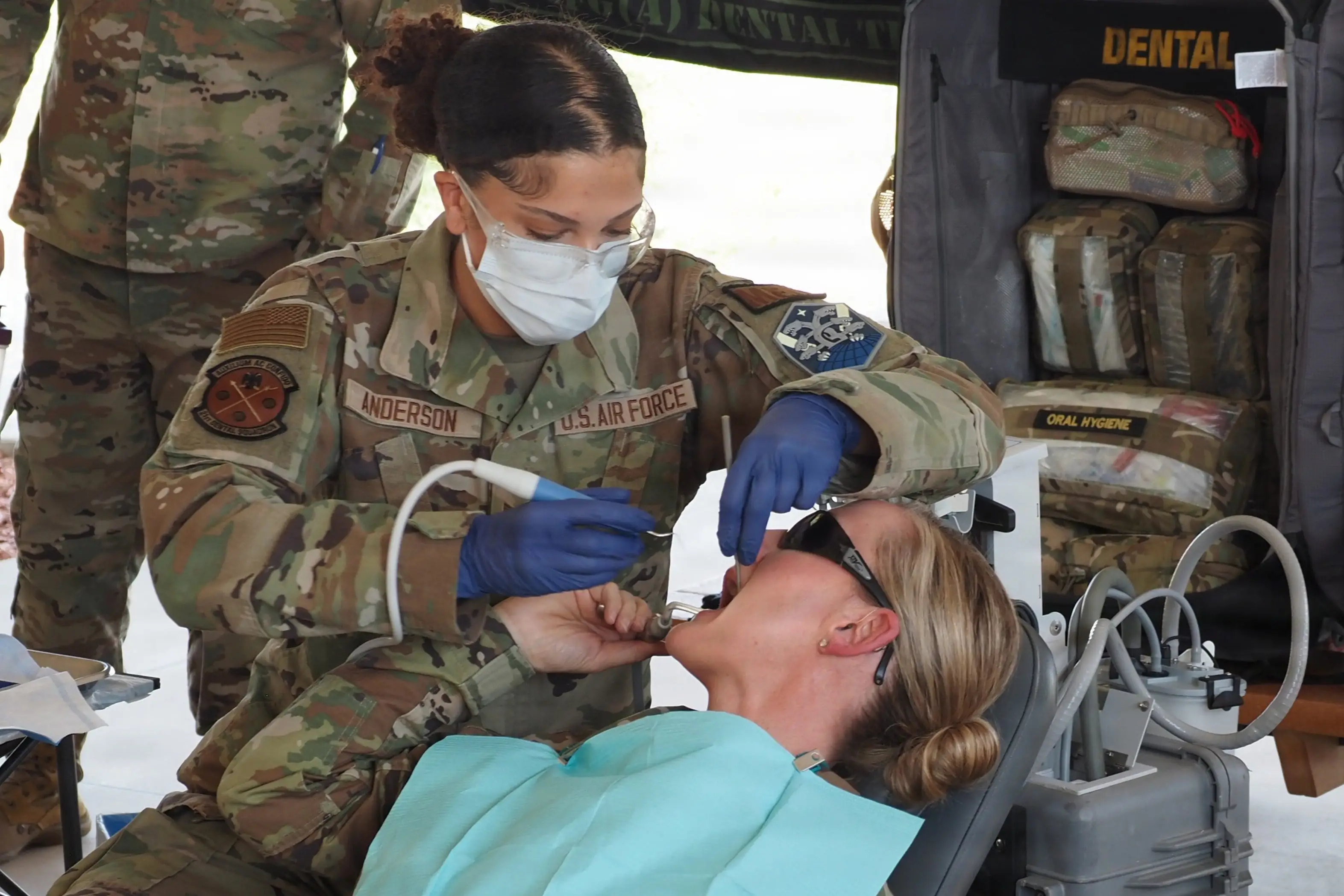 An Air Force dental assistant uses a mobile battlefield dental cleaning machine at Peterson Space Force Base, Colorado., on Aug. 7, 2026.