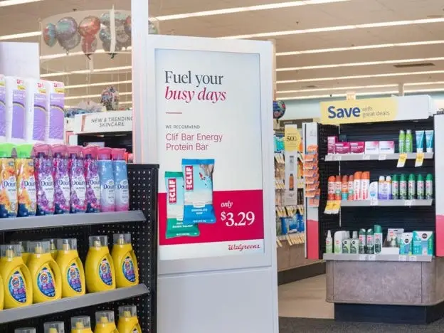 A Clif bar promo on a screen at Walgreens
