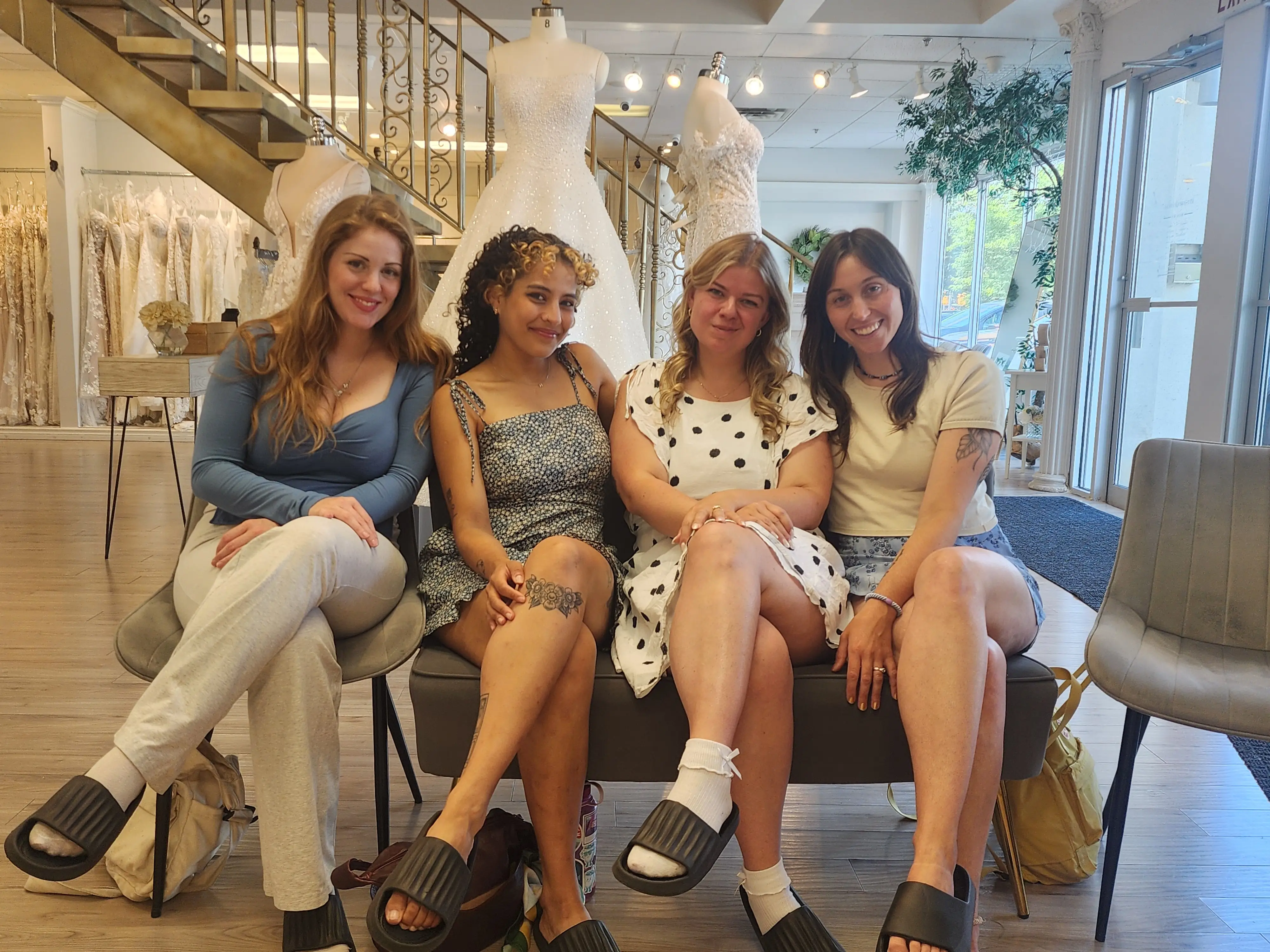 Woman posing for photo at bridal shop