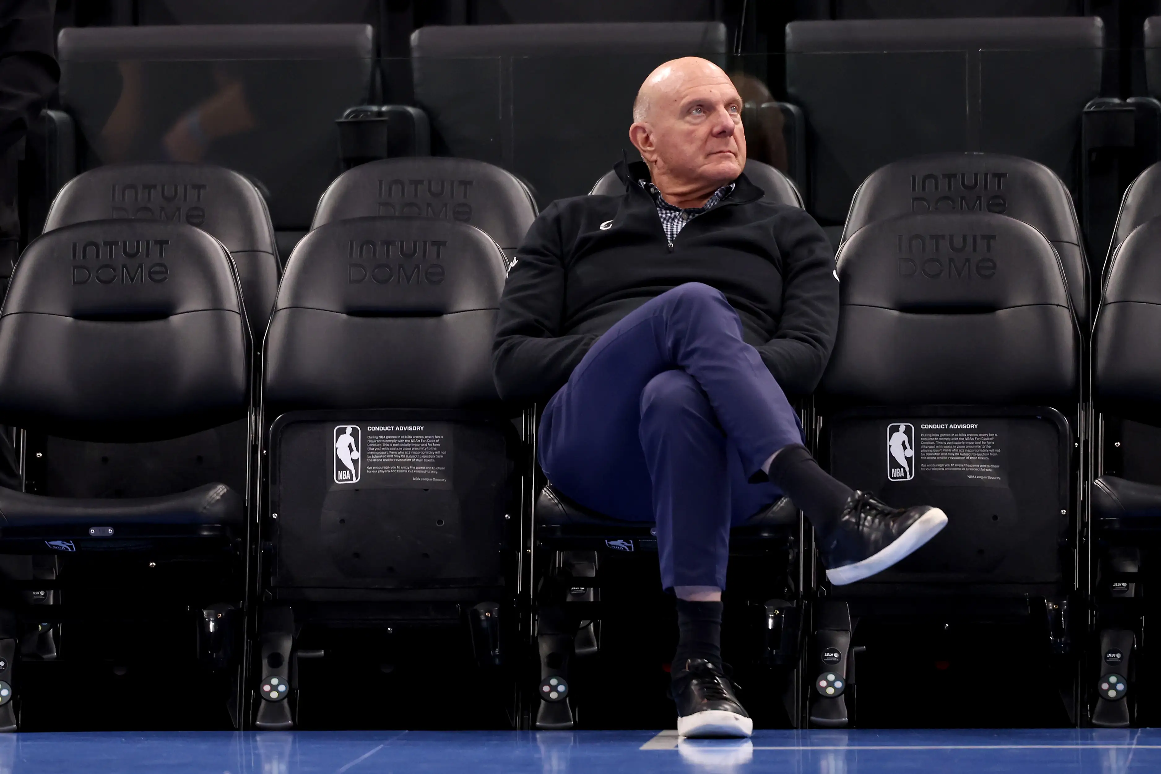 Steve Ballmer watches warm ups prior to a game at the Intuit Dome