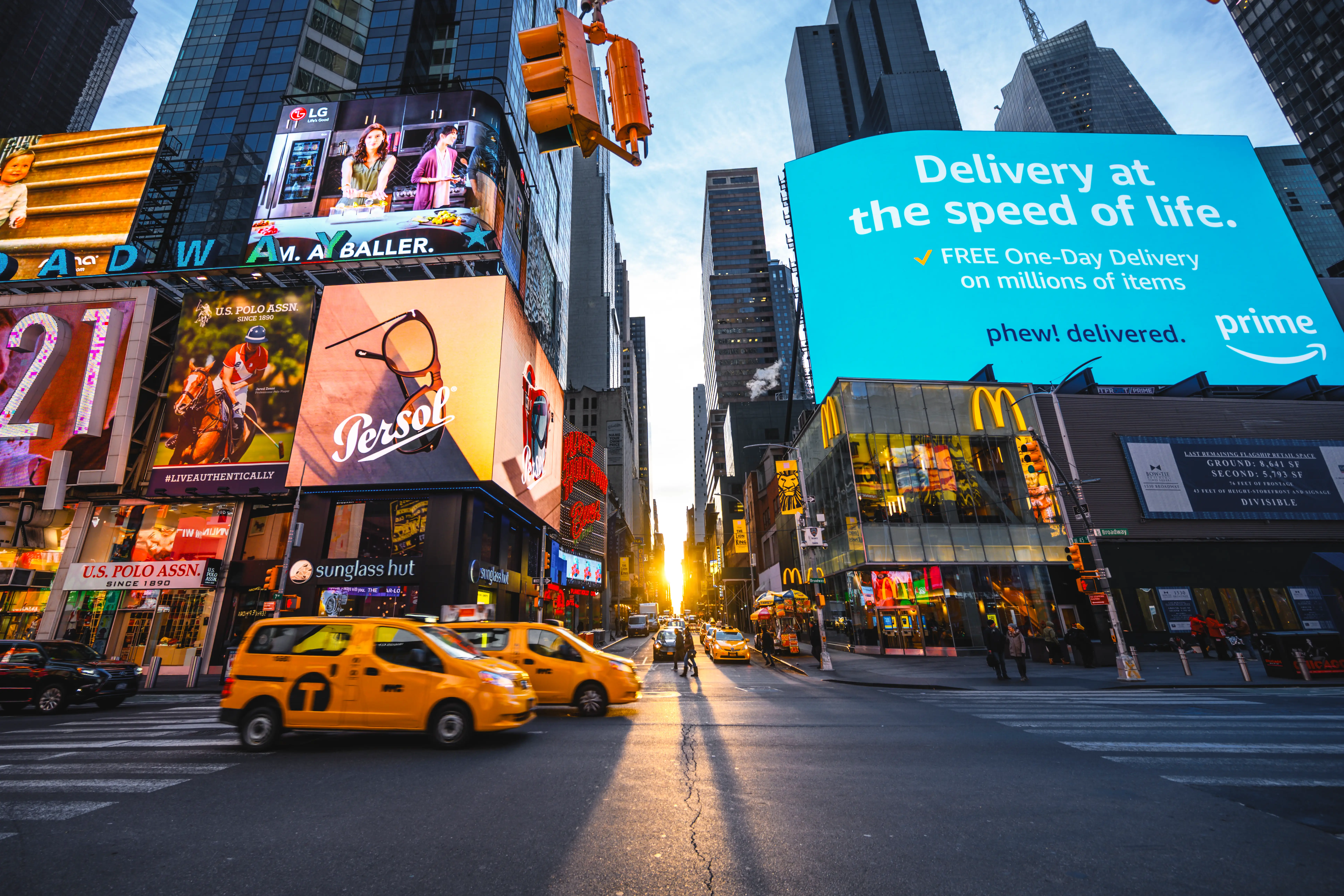 View of new york city billboards, yellow taxis