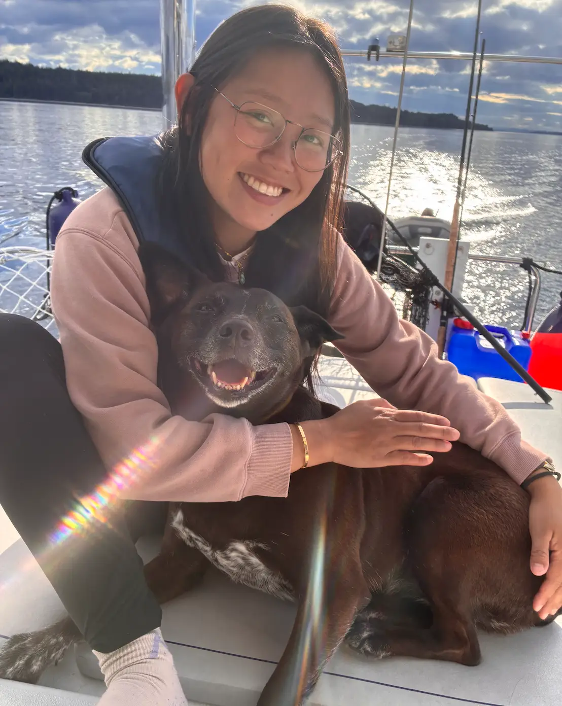 woman and dog on boat