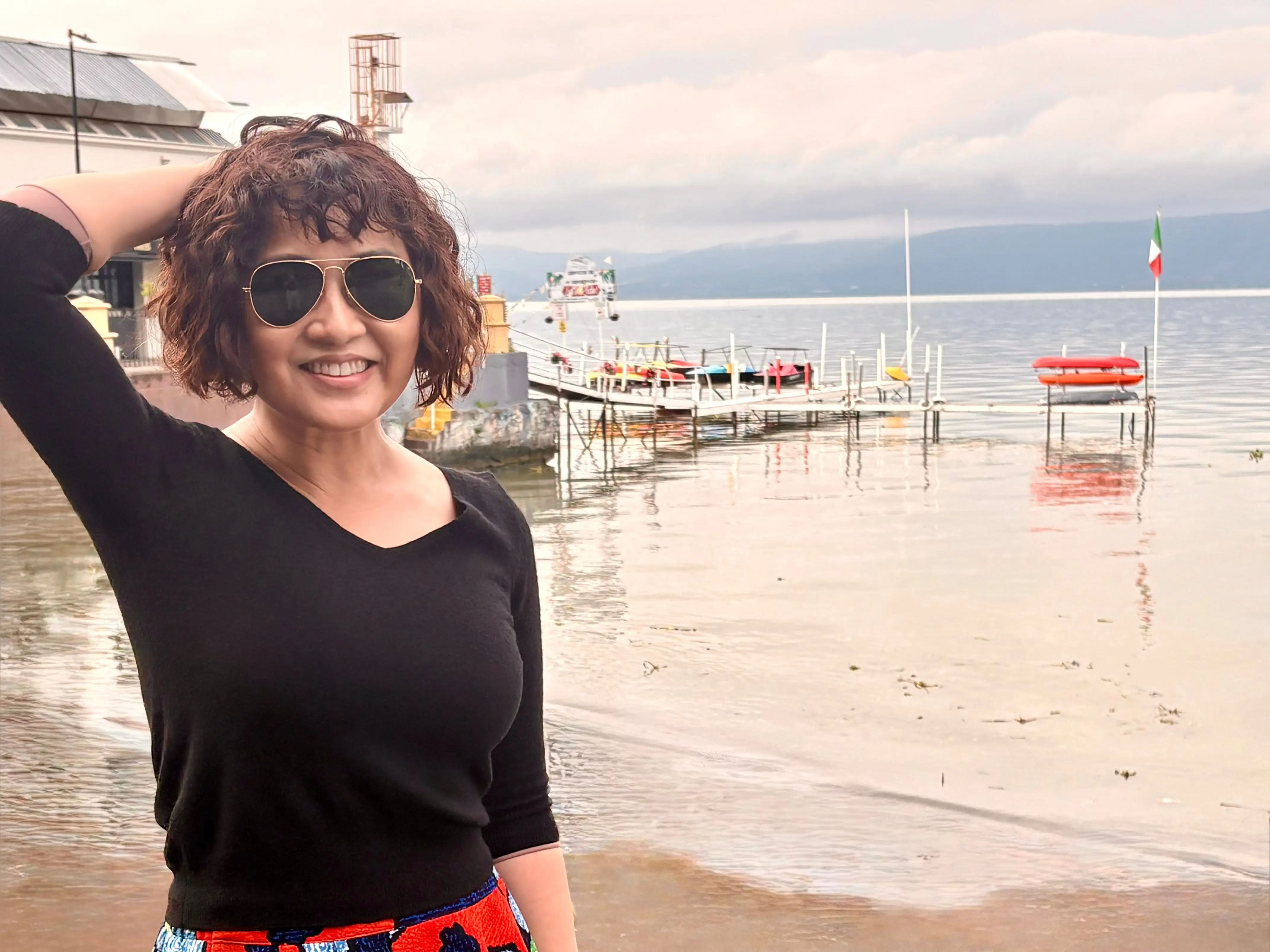 Woman smiling in front of Lake Chapala