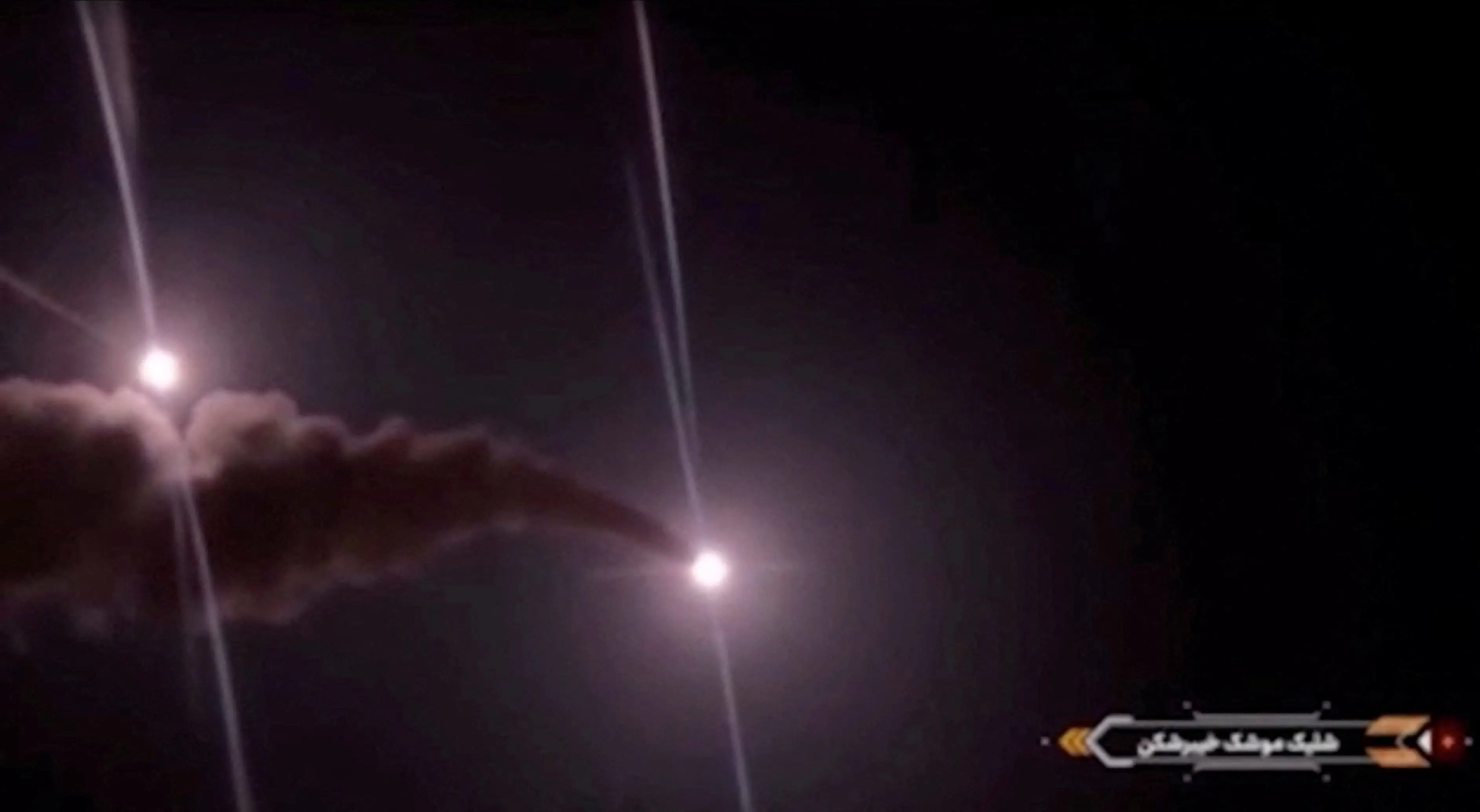 Projectiles streak across the sky in this screengrab taken from footage published by Iranian authorities purporting to show missiles launched at US military targets in Jordan from an unknown location, released on August 31, 2026.