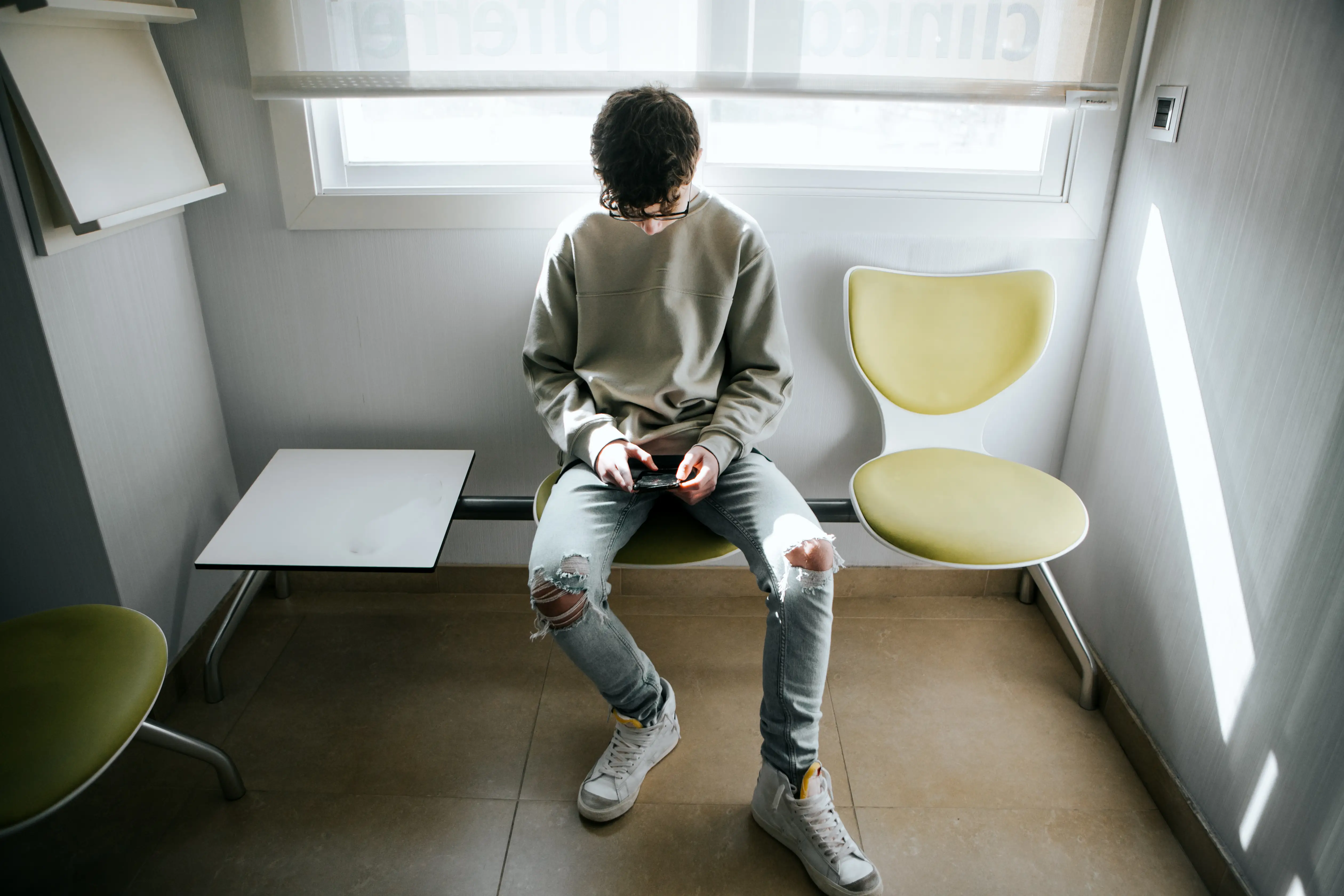 Teenage boy looking at phone