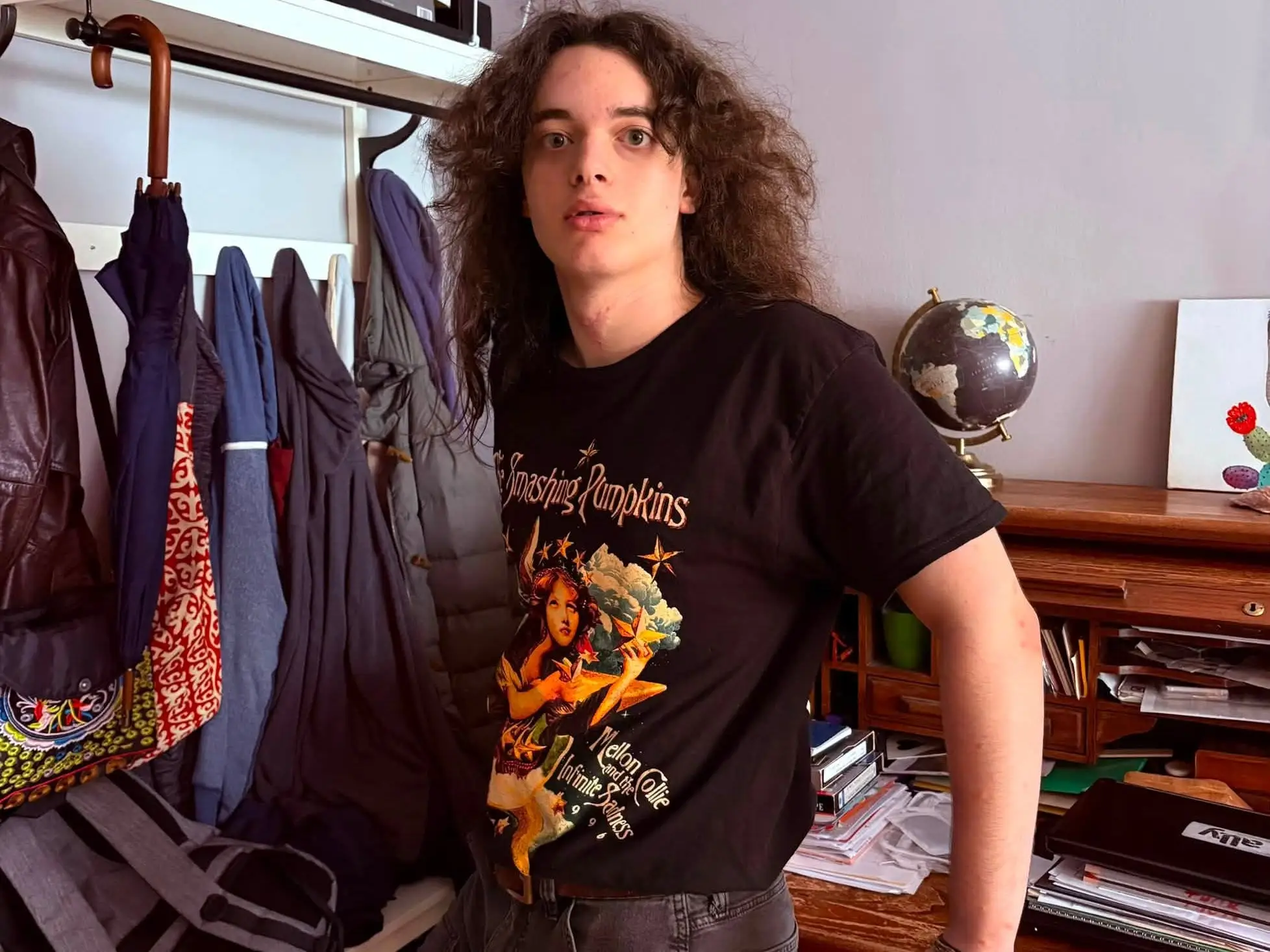 young man with smashing pumkins shirt
