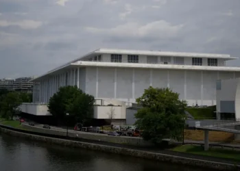 The Kennedy Center’s board voted to close until Trump’s name is added. Here’s a look at the history behind the landmark.