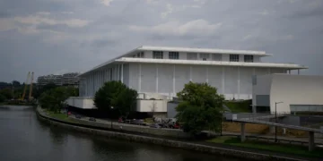 The Kennedy Center’s board voted to close until Trump’s name is added. Here’s a look at the history behind the landmark.