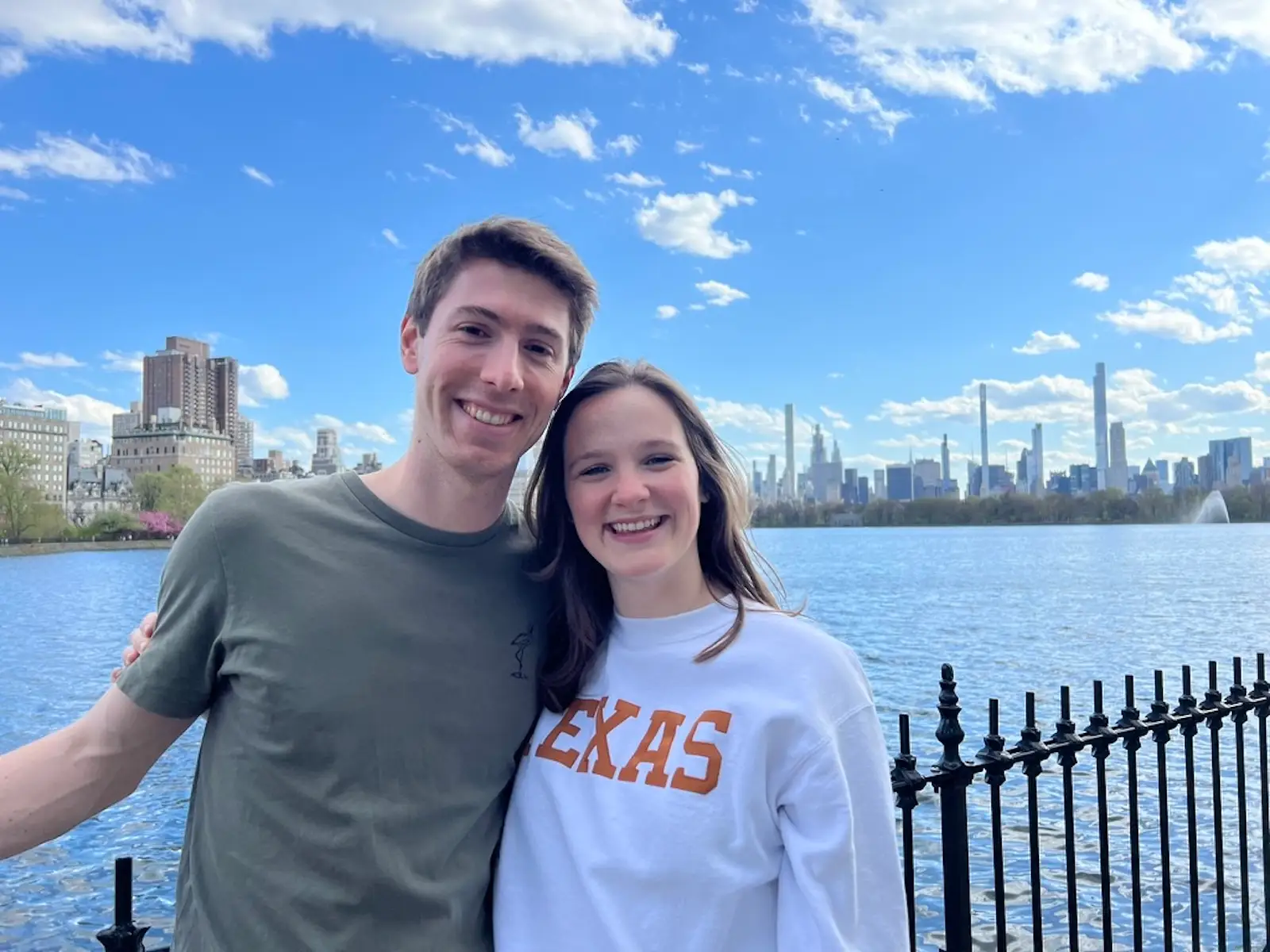 The couple poses near water in New York City.