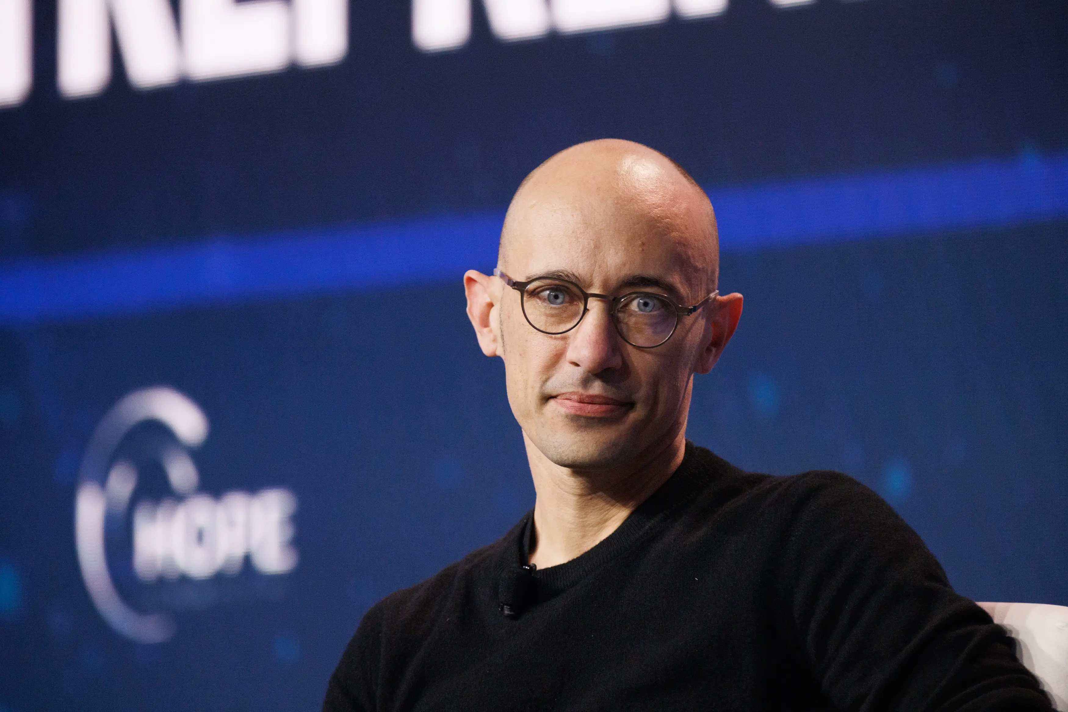 Tobias Lütke, Shopify's CEO, looks to his left during an onstage interview.