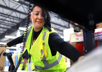Amazon is upping its minimum hourly wage for operations workers — and offering employees a new Whole Foods discount