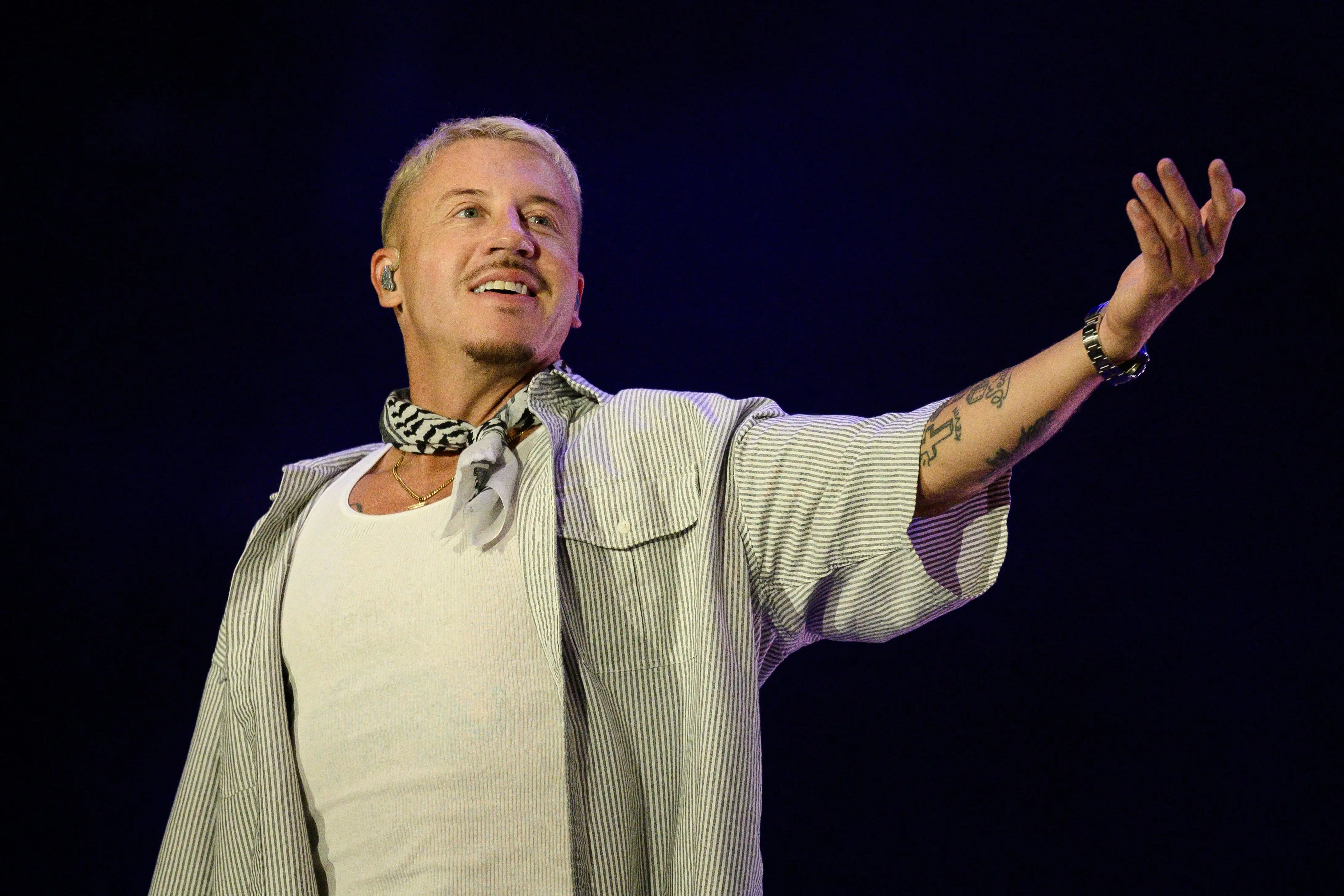 US rapper, singer, dancer and DJ, Benjamin Haggerty, known as Macklemore, performs at the Goldencoast Rap Festival in Corcelles-les-Monts, near Dijon, central-eastern France, on August 30, 2026.