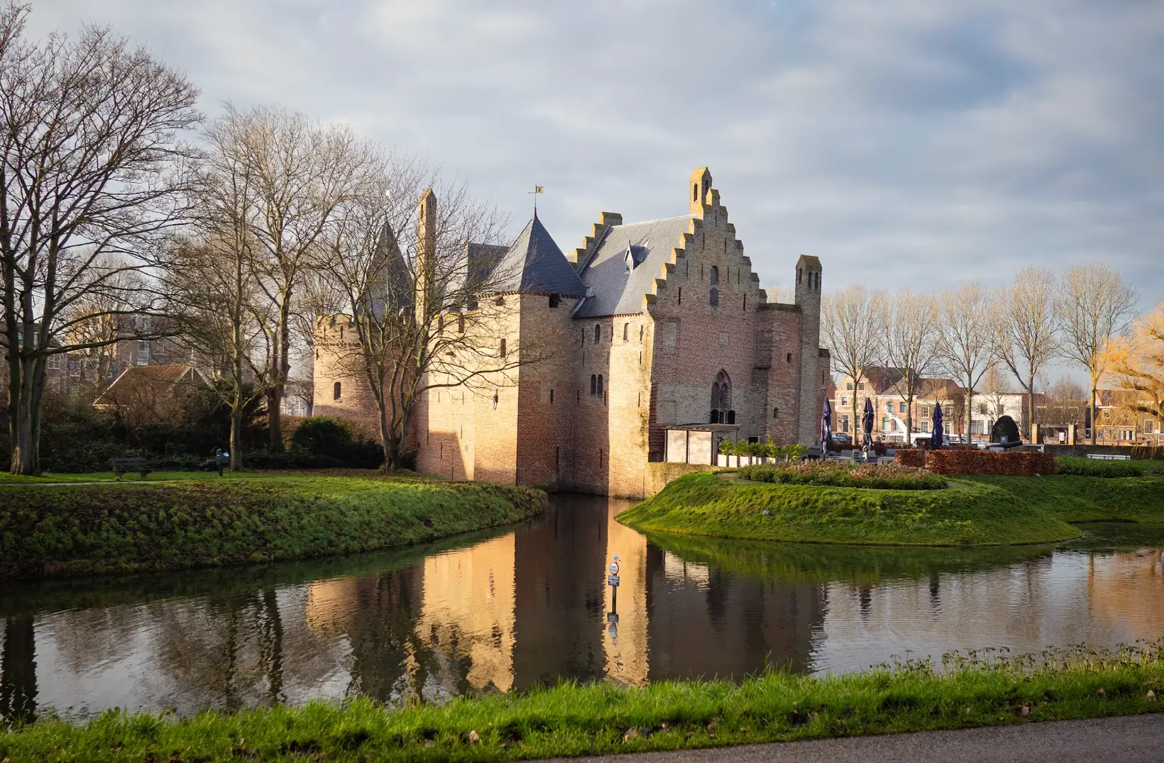 Radboud Castle, surrounded by water and grassy lawns in Medemblik.