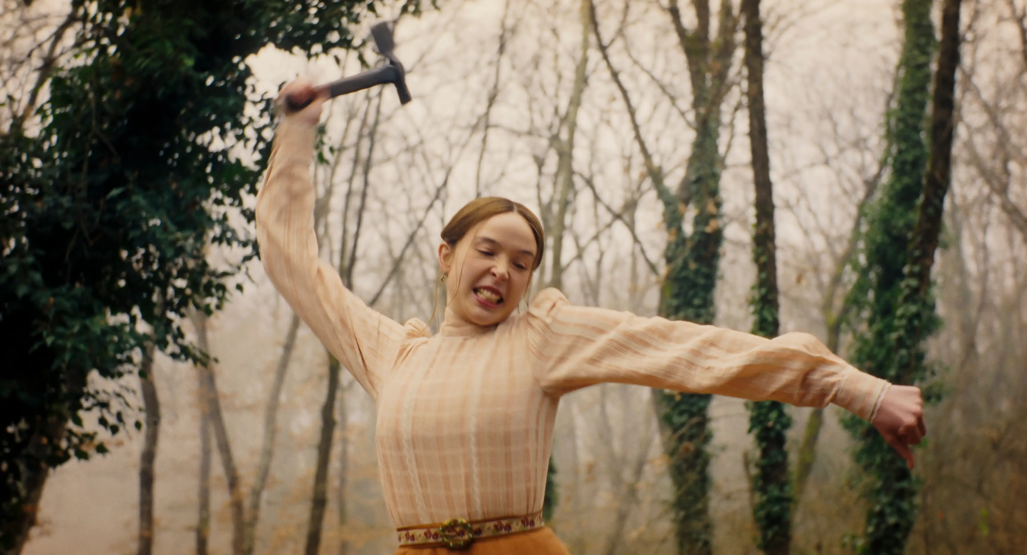 Ella Beatty lifting up a hatchet in Monster The Lizzie Borden Story