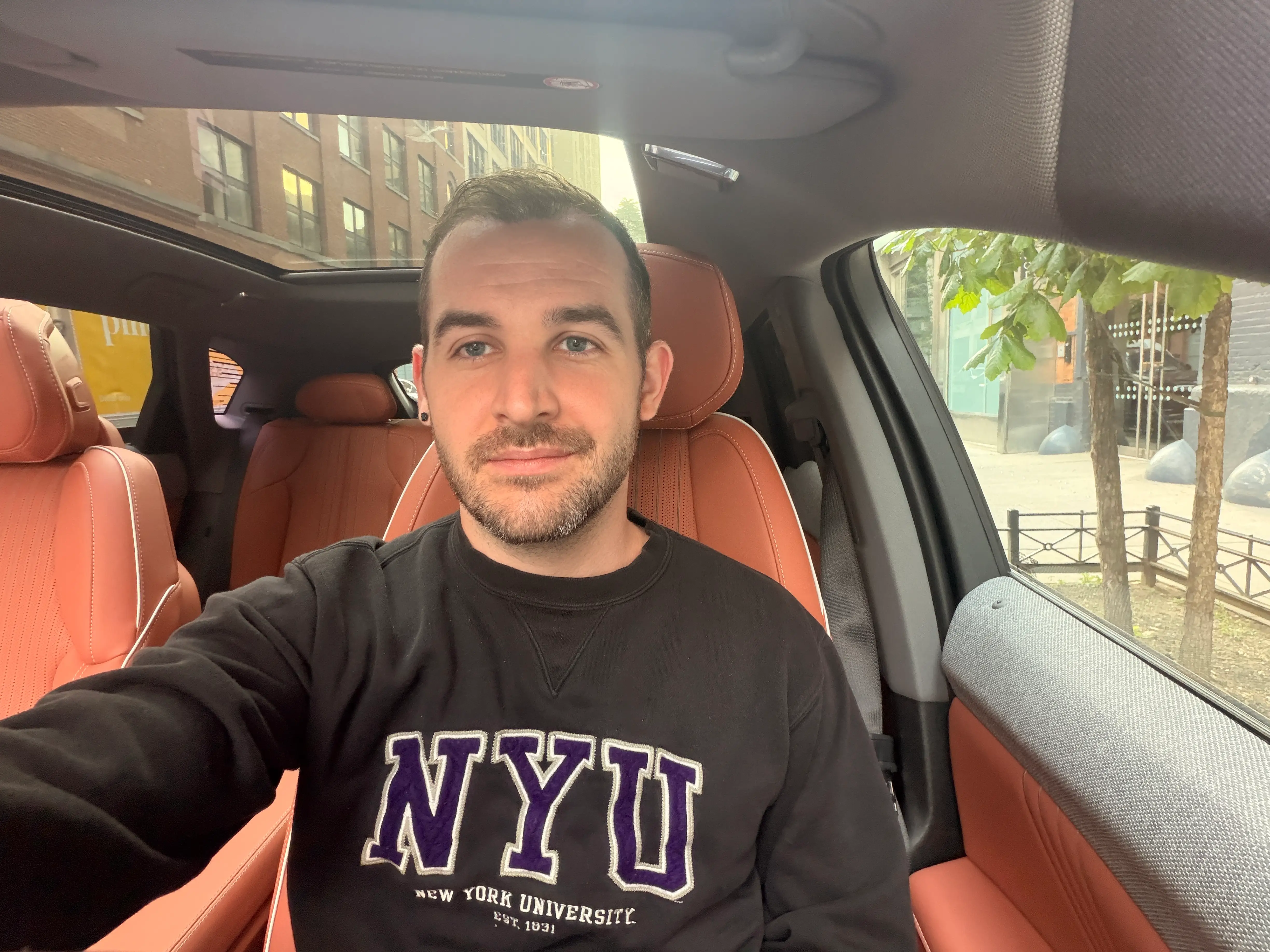 Ben Shimkus, Business Insider's autos reporter, sits inside the Cadillac Optiq.