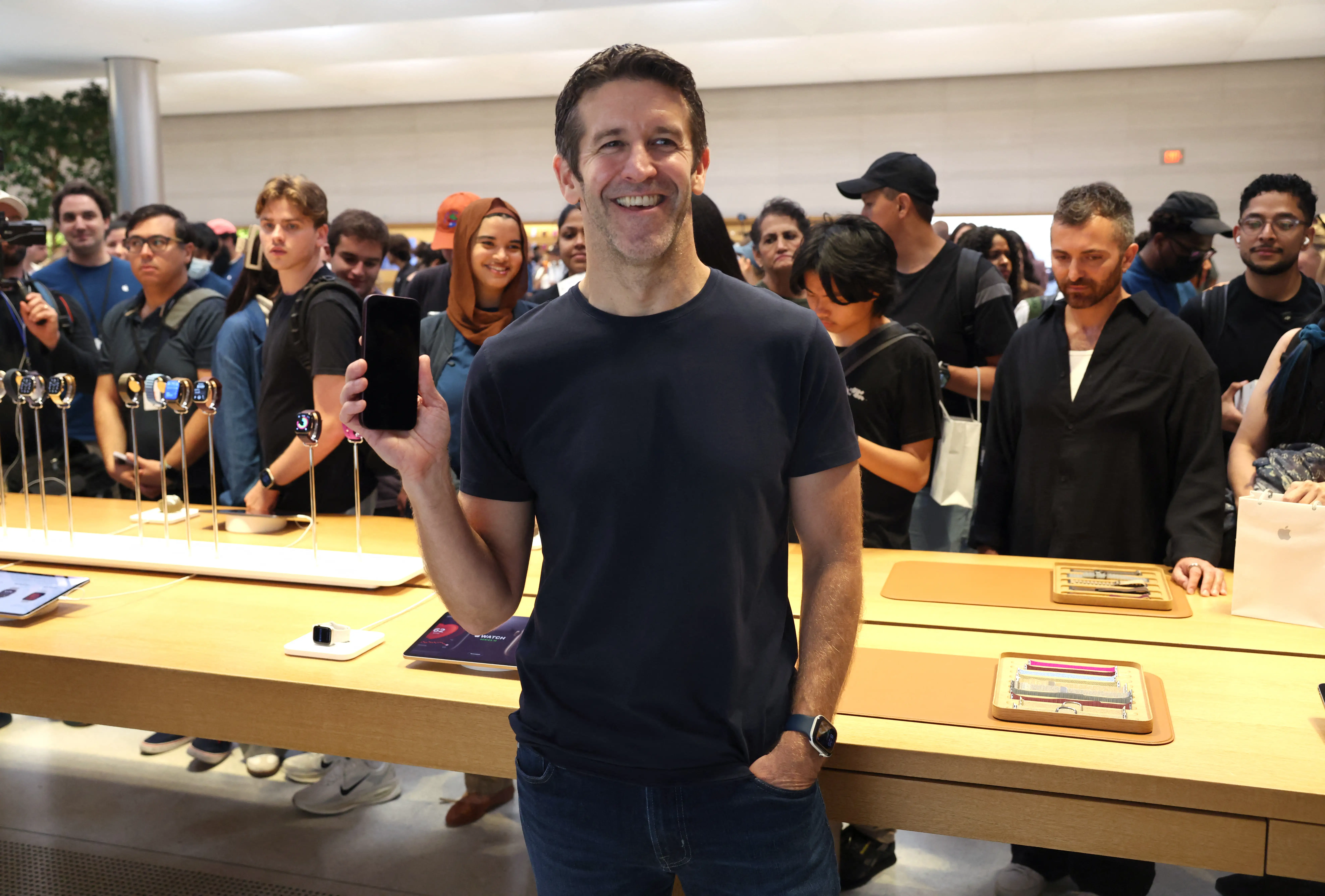 Apple CEO John Ternus holds an iPhone in his right hand during Friday's release of the iPhone 18 Pro in New York City.