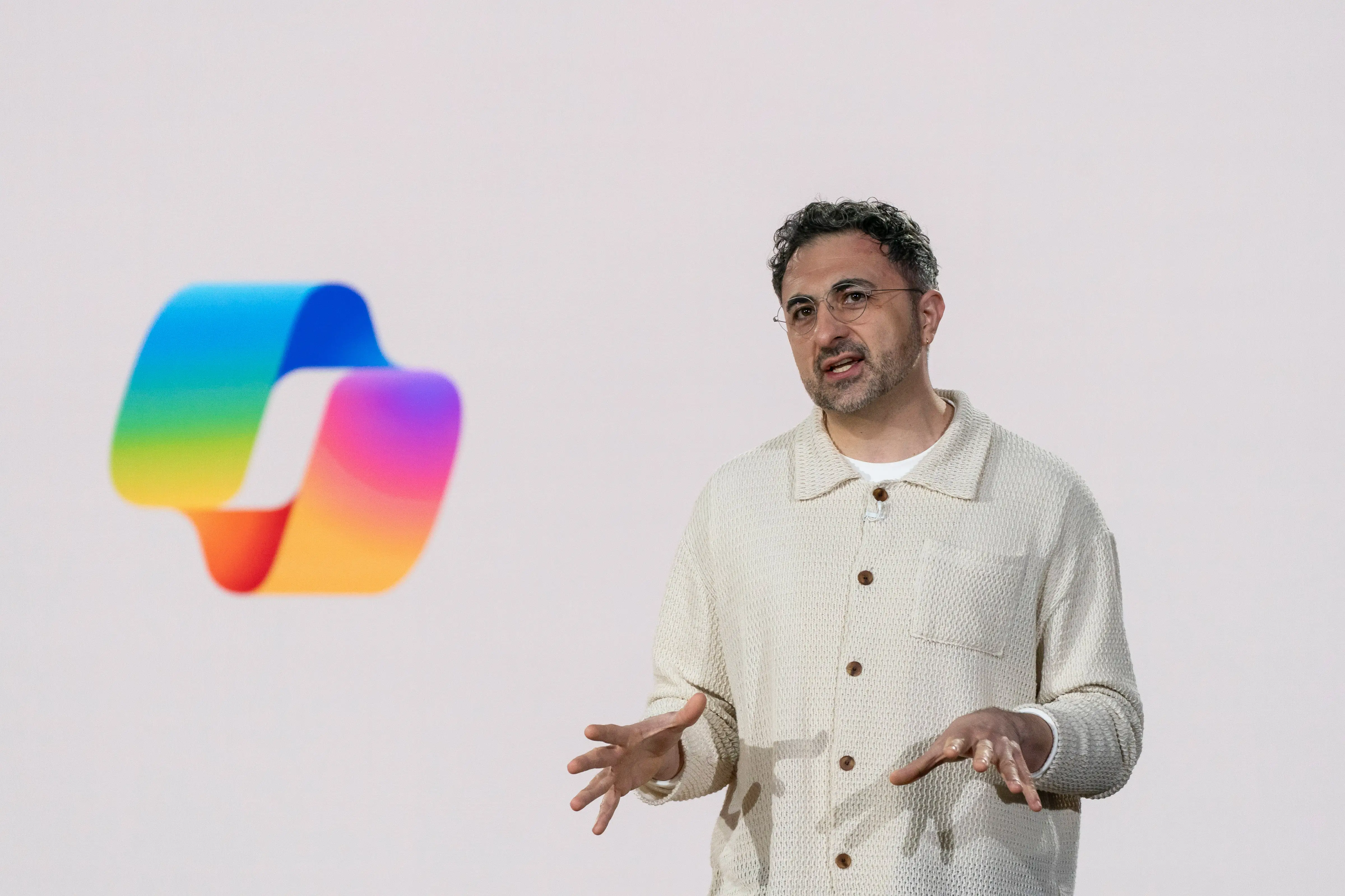 Mustafa Suleyman speaks during an event