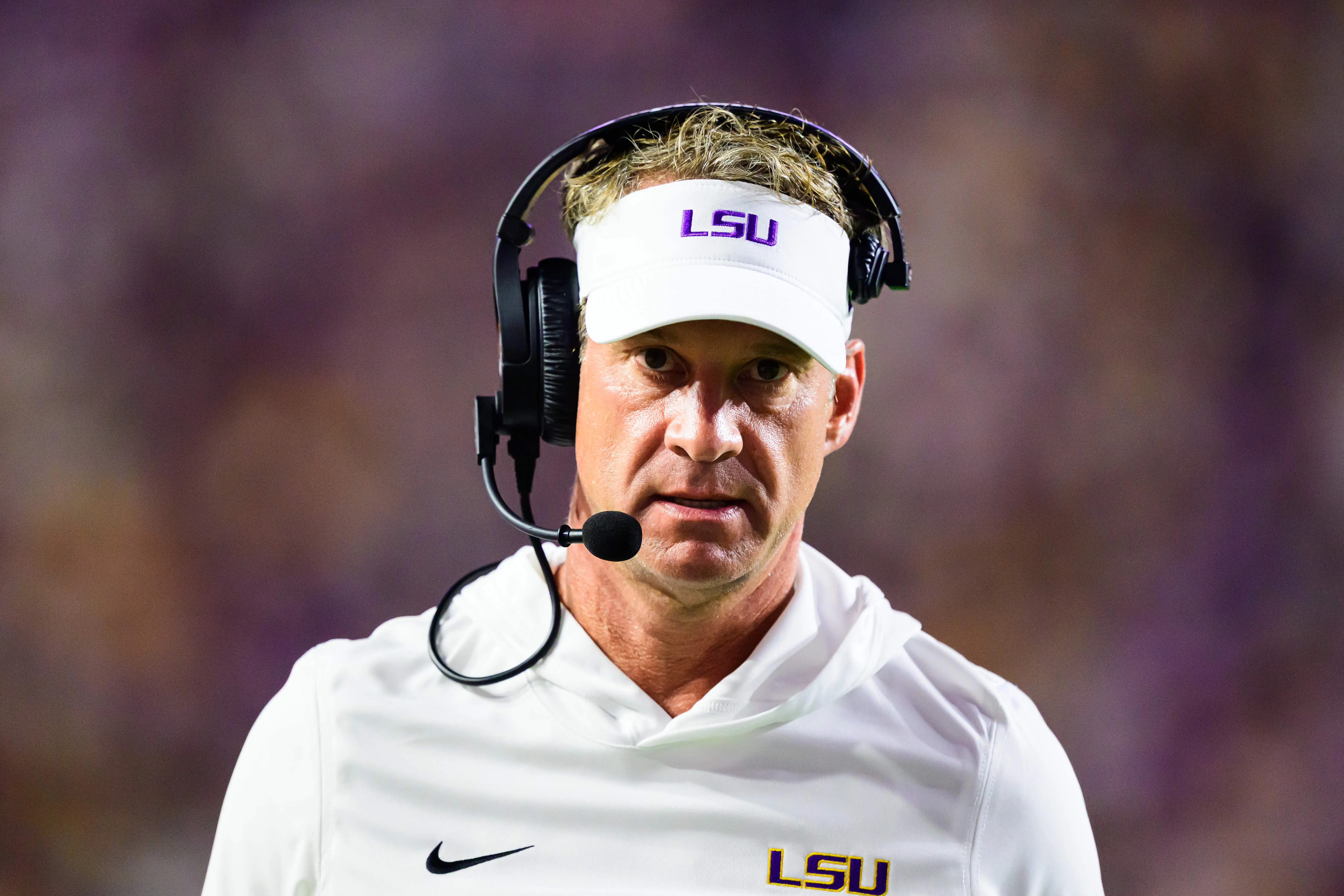 LSU coach Lane Kiffin looks on during a football game