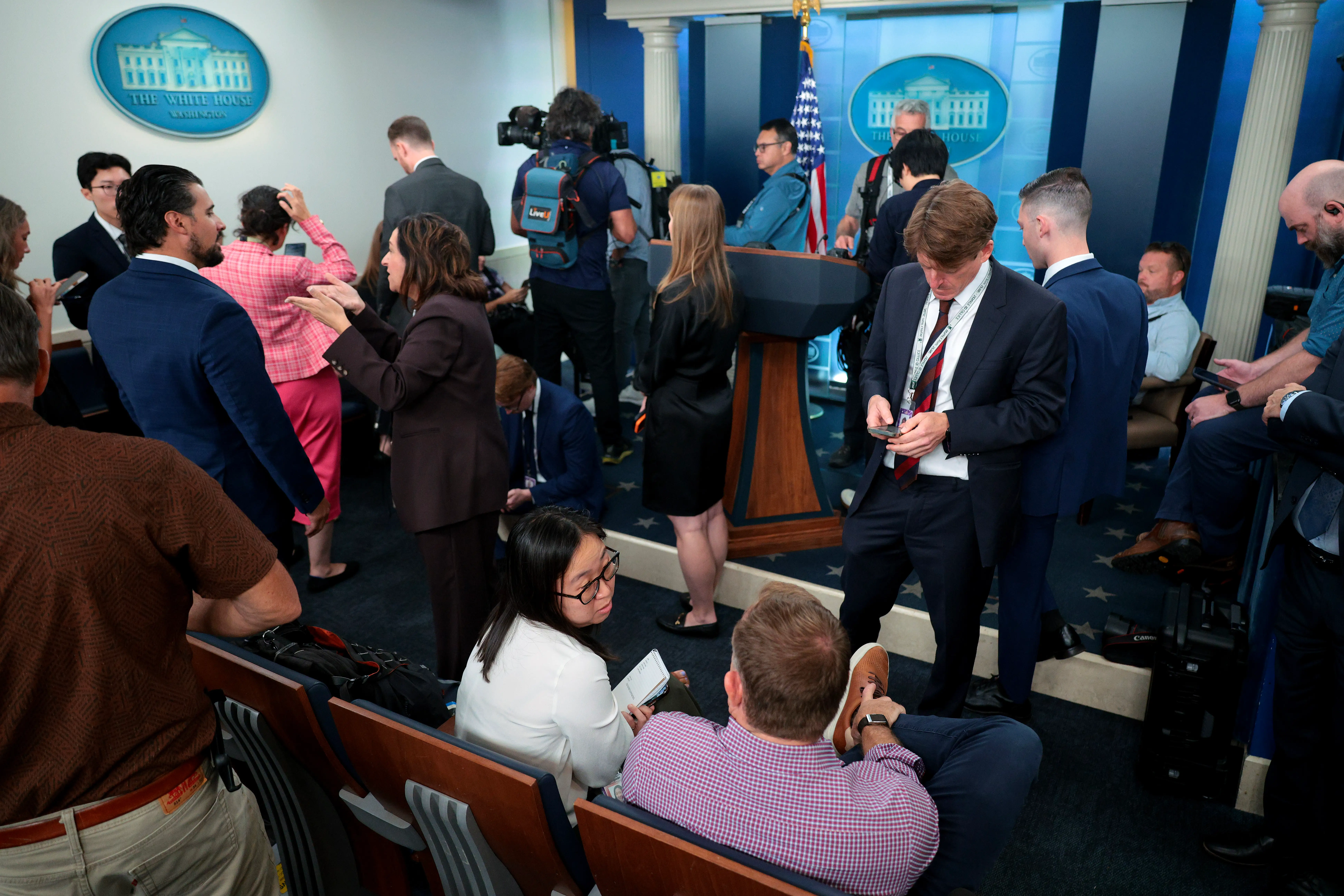 Journalists gather in the Brady Press Briefing Room before going into the Oval Office at the White House on September 18, 2026
