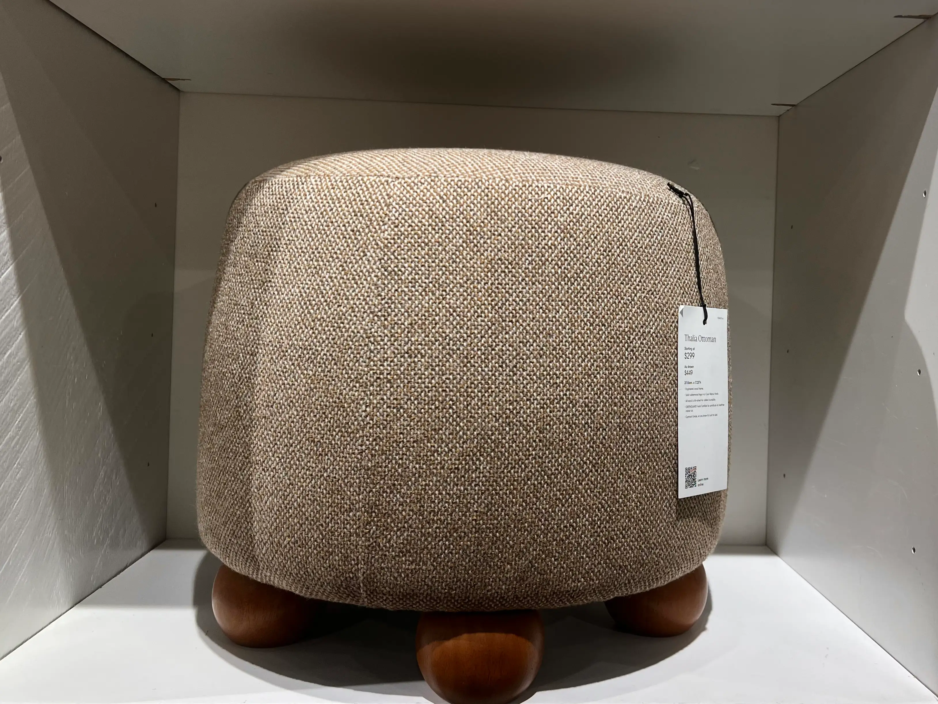 A small brown ottoman.