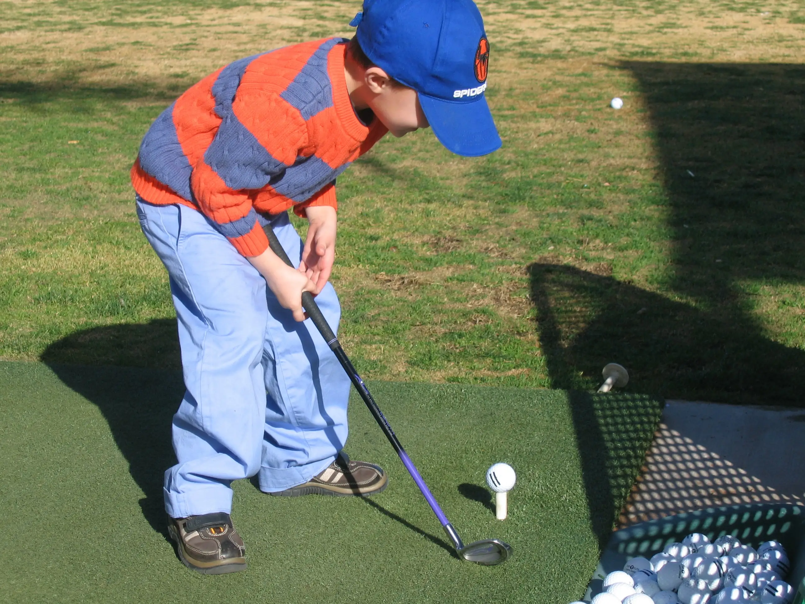 The author's son is shown at a driving range when he was a young boy.