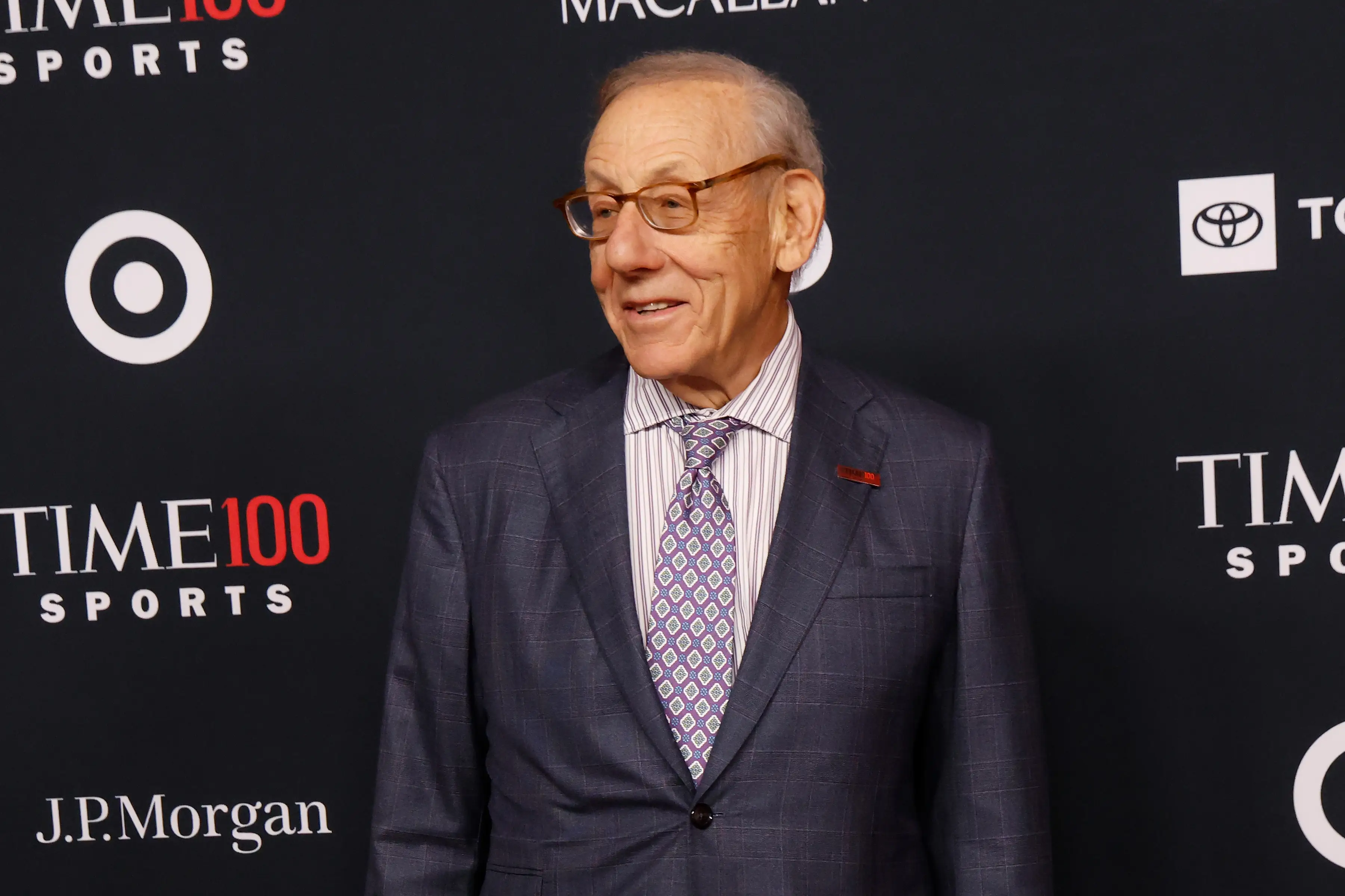 Stephen Ross stands before a TIME100 Sports backdrop with Target, Toyota and J.P.Morgan logos.