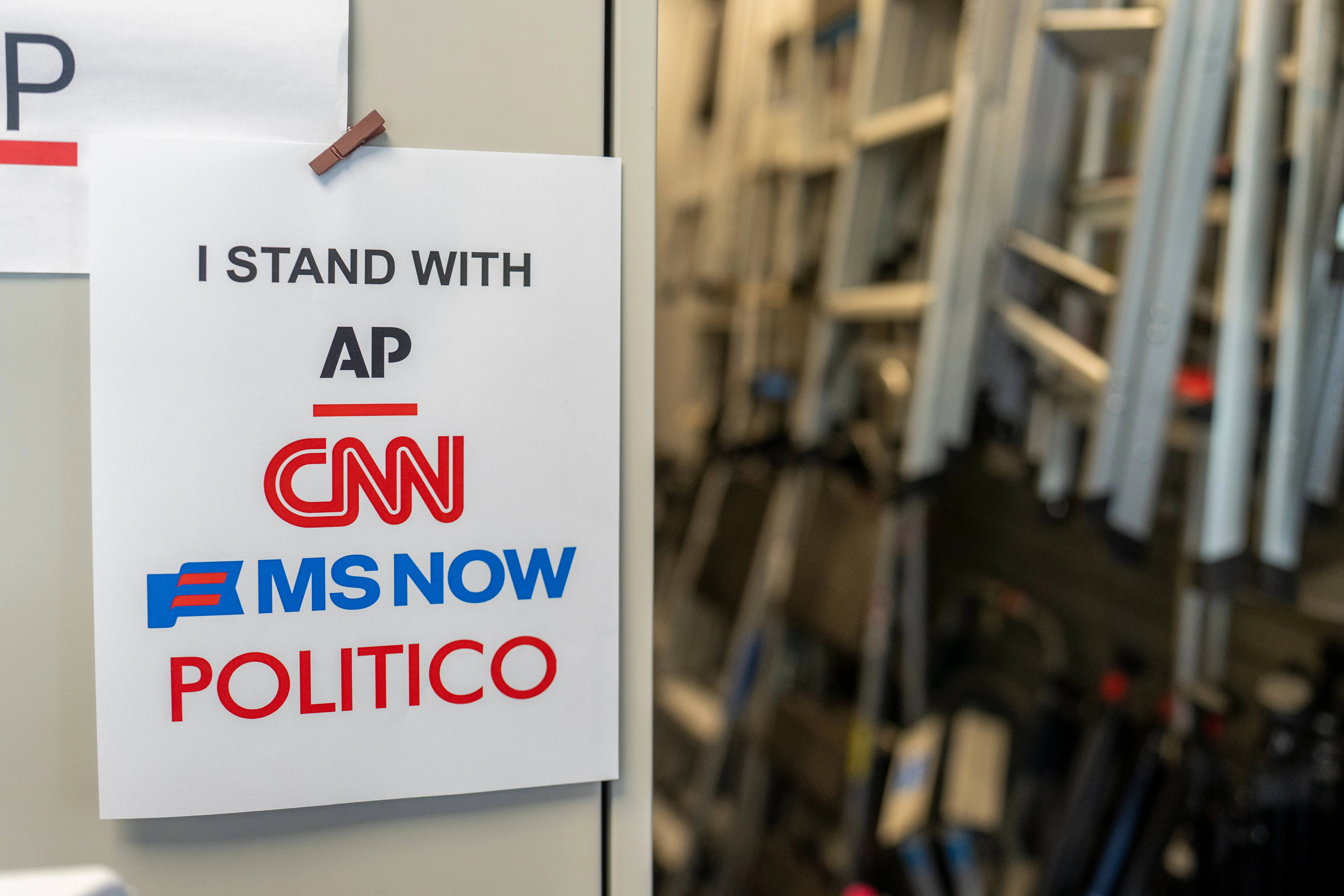 A sign in support of AP, CNN, MS NOW, and Politico near the James S. Brady Press Briefing Room of the White House in Washington, DC, US, on Monday, Sept. 21, 2026.