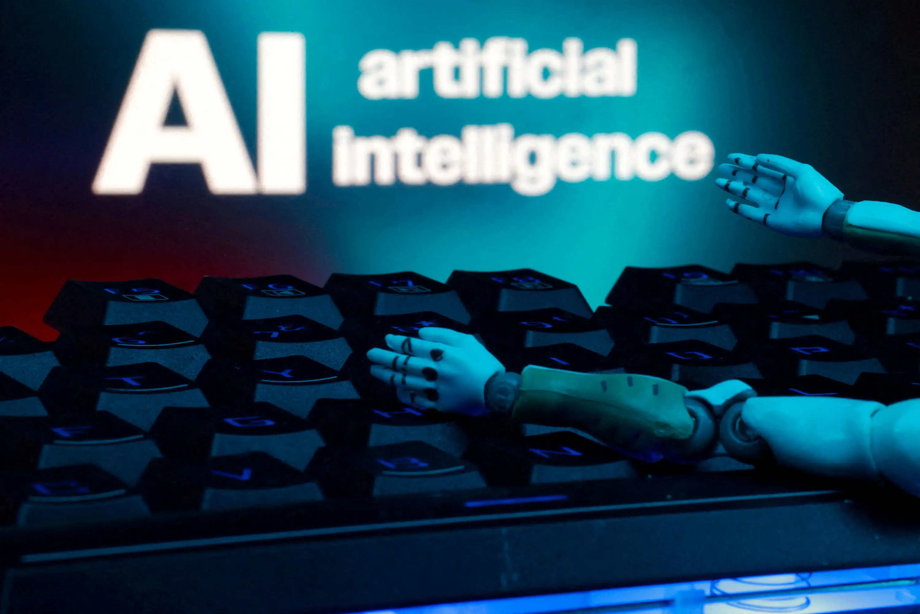 A robot figurine's hands are held in front of a keyboard.