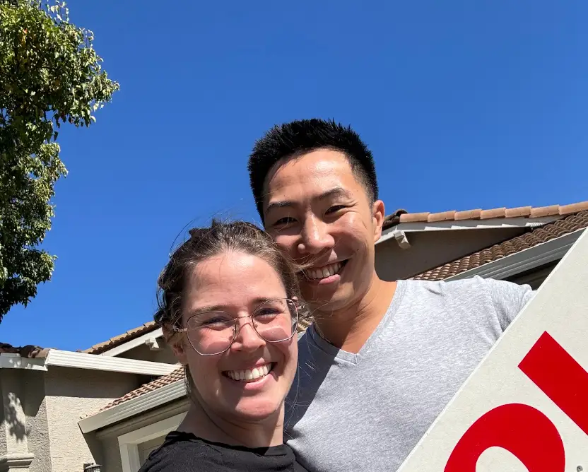 A selfie of the writer and her husband in front of their house in California.
