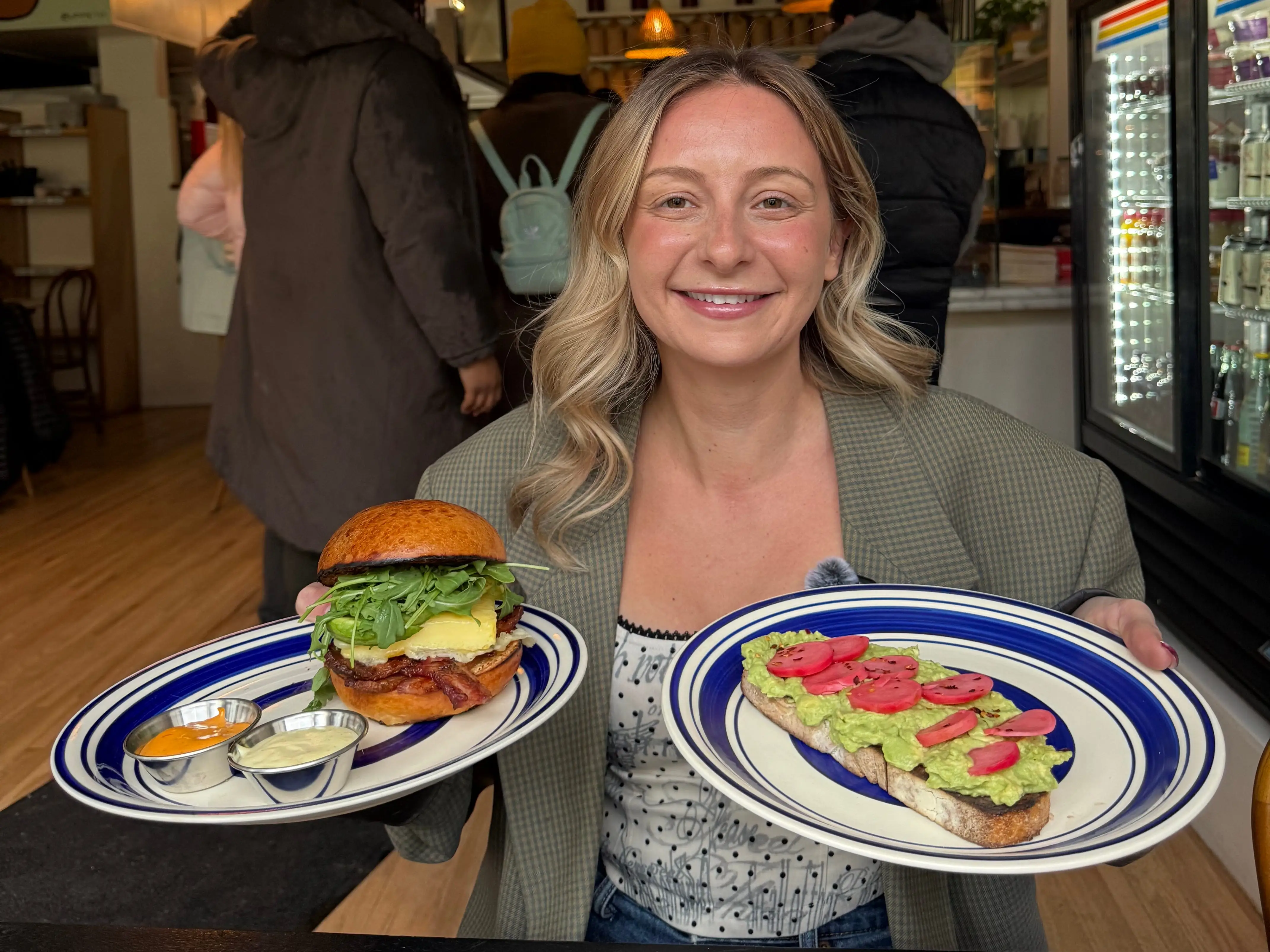 the founder of The Nitro Bar in one of the locations holding up food