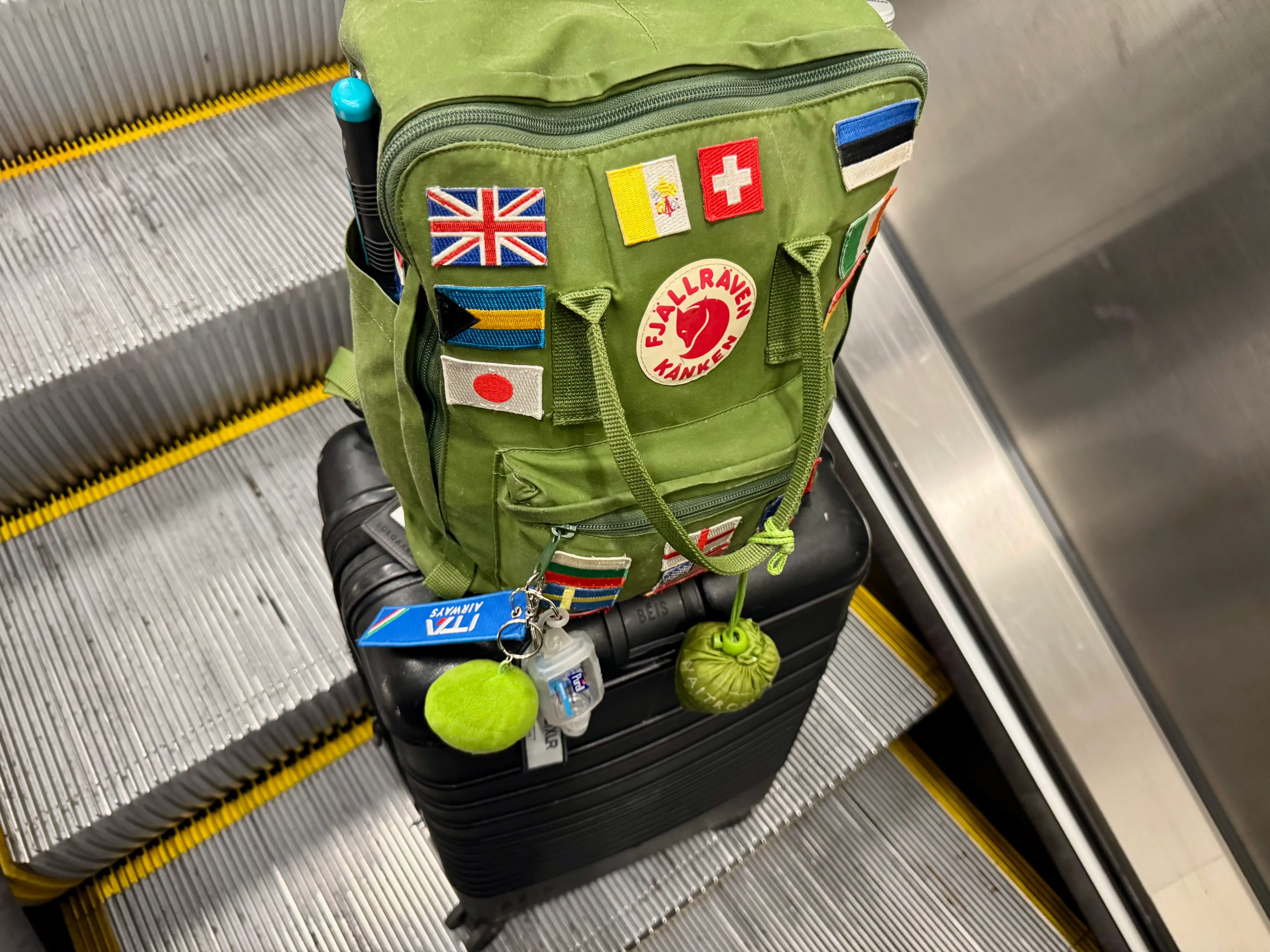 The author's Beis back and green backpack.