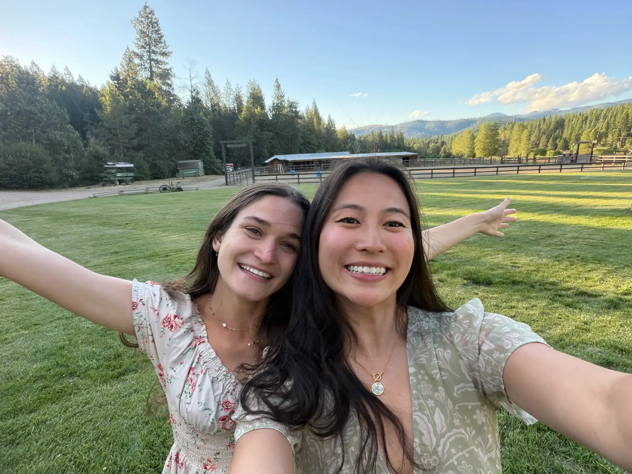 Anna and Ellie take a selfie on a ranch.