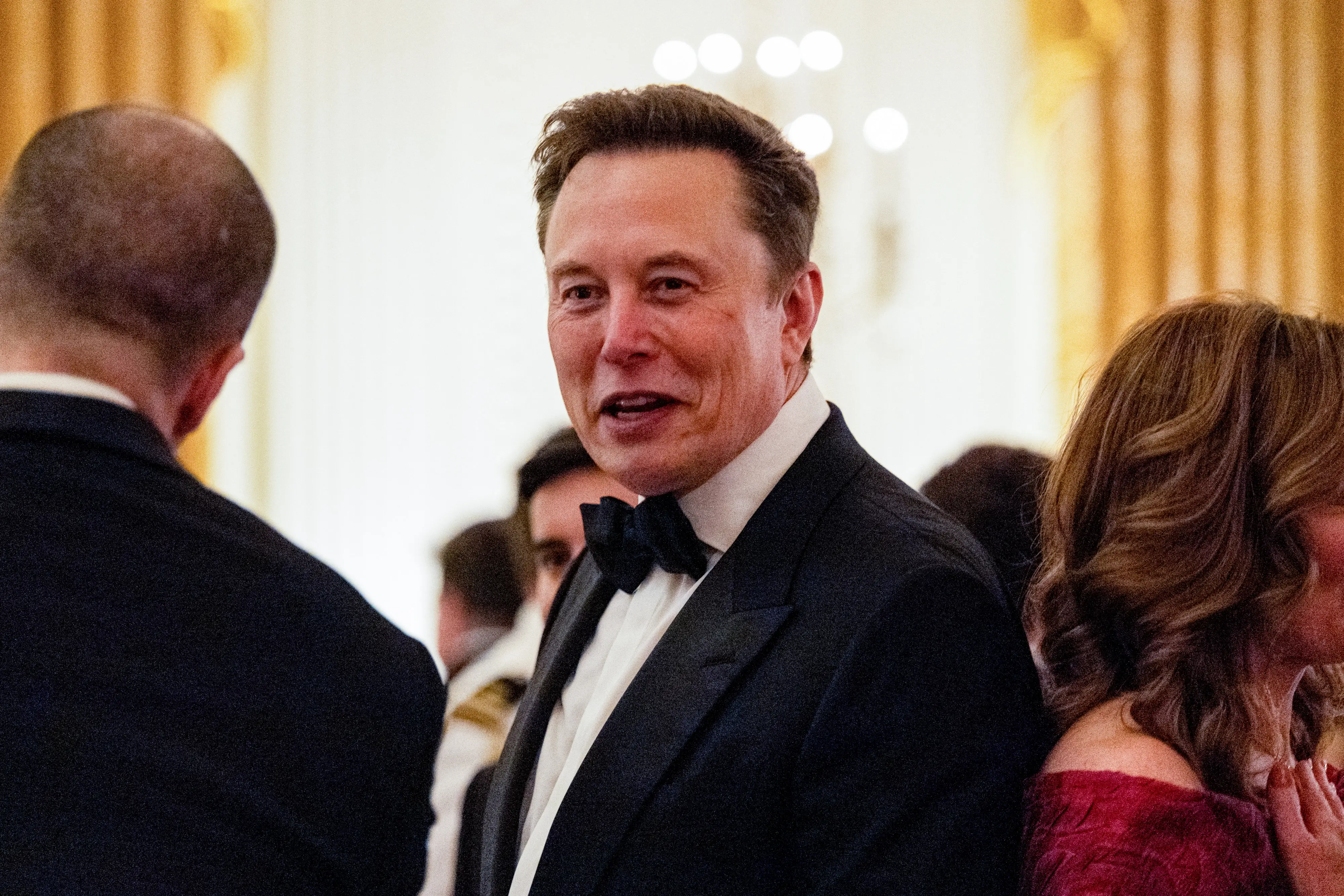Elon Musk is seen speaking during a state dinner at the White House