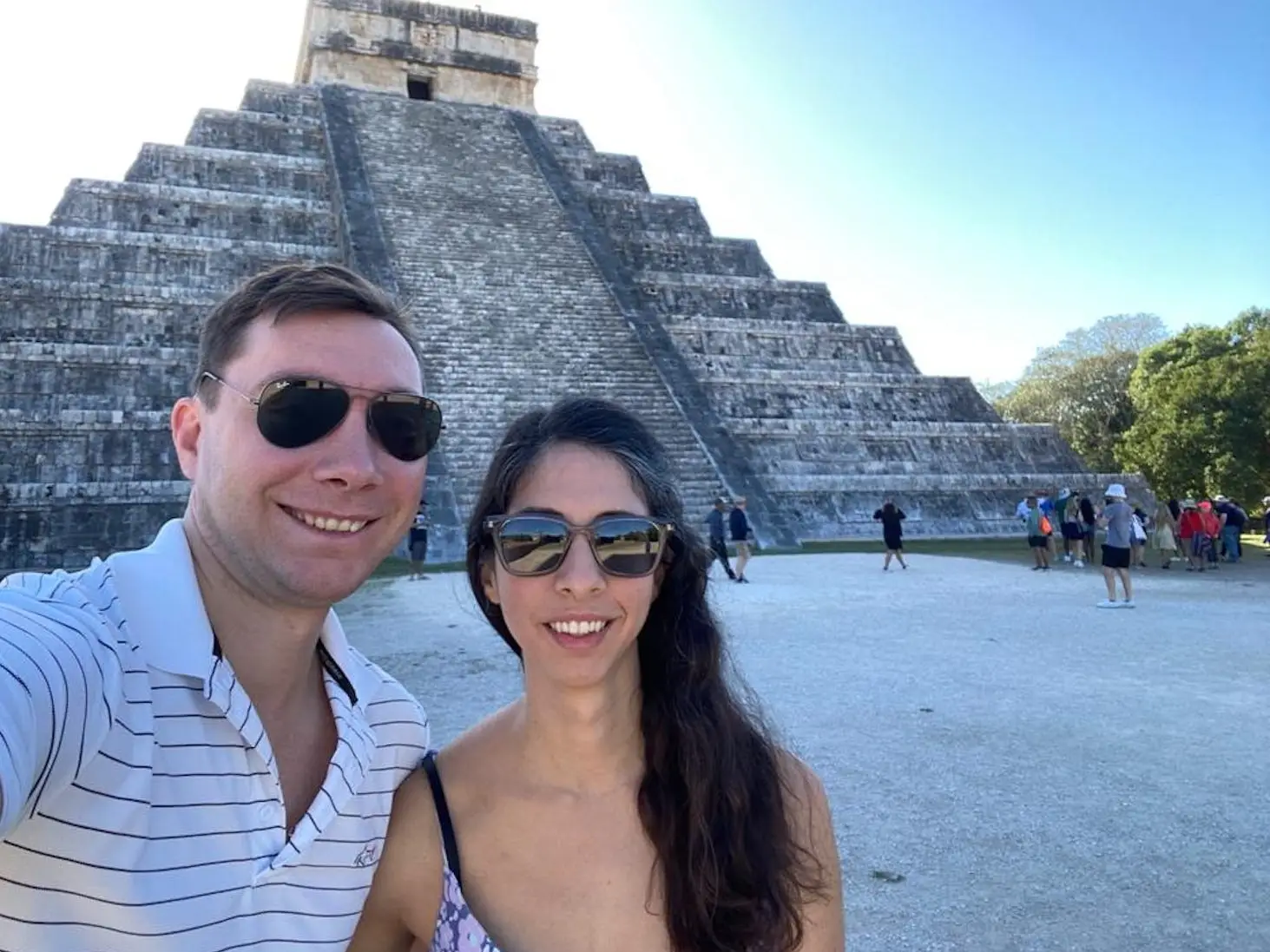 The author and her husband while on vacation, ruins are in the background.