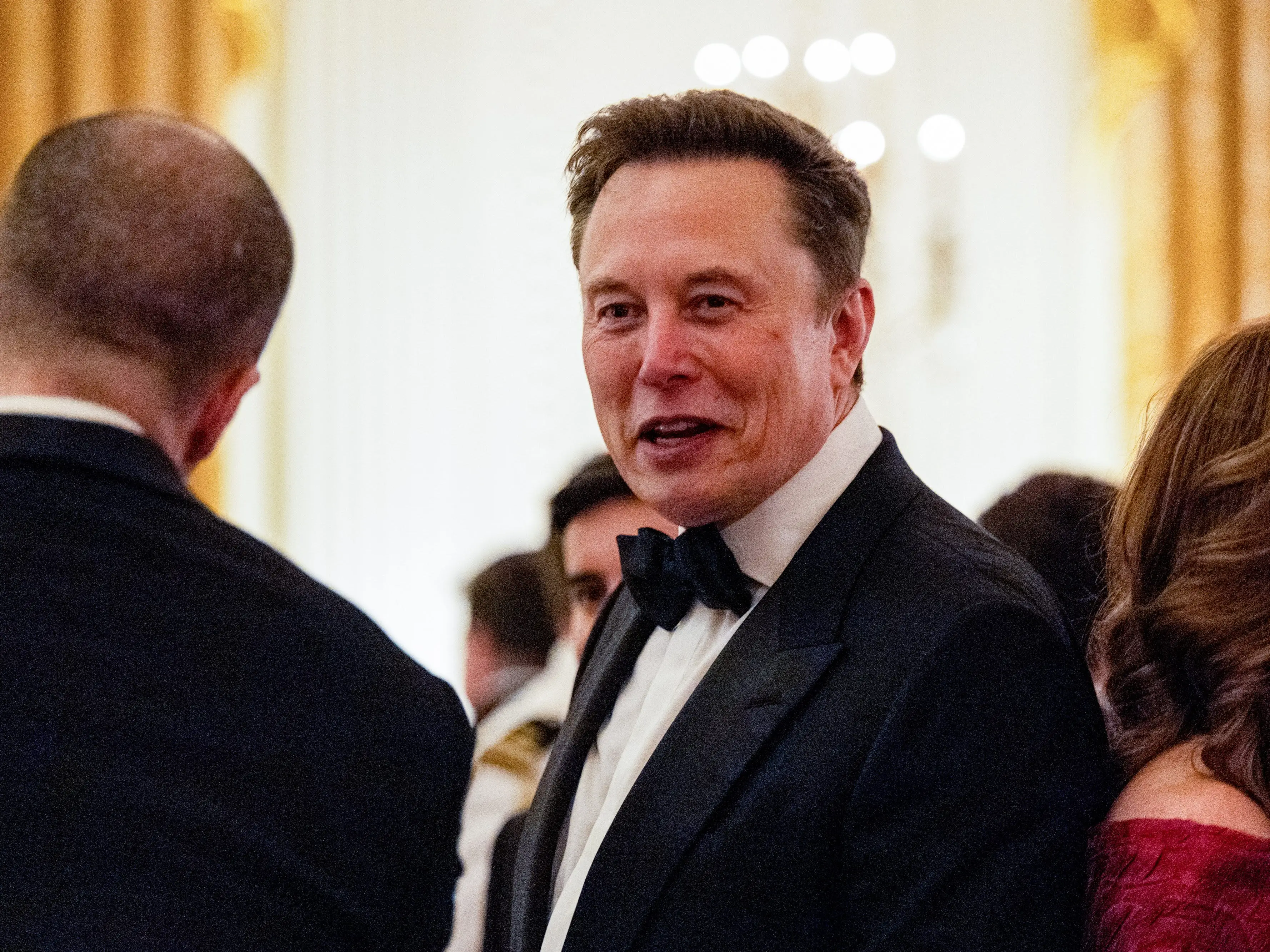 Elon Musk is seen speaking during a state dinner at the White House