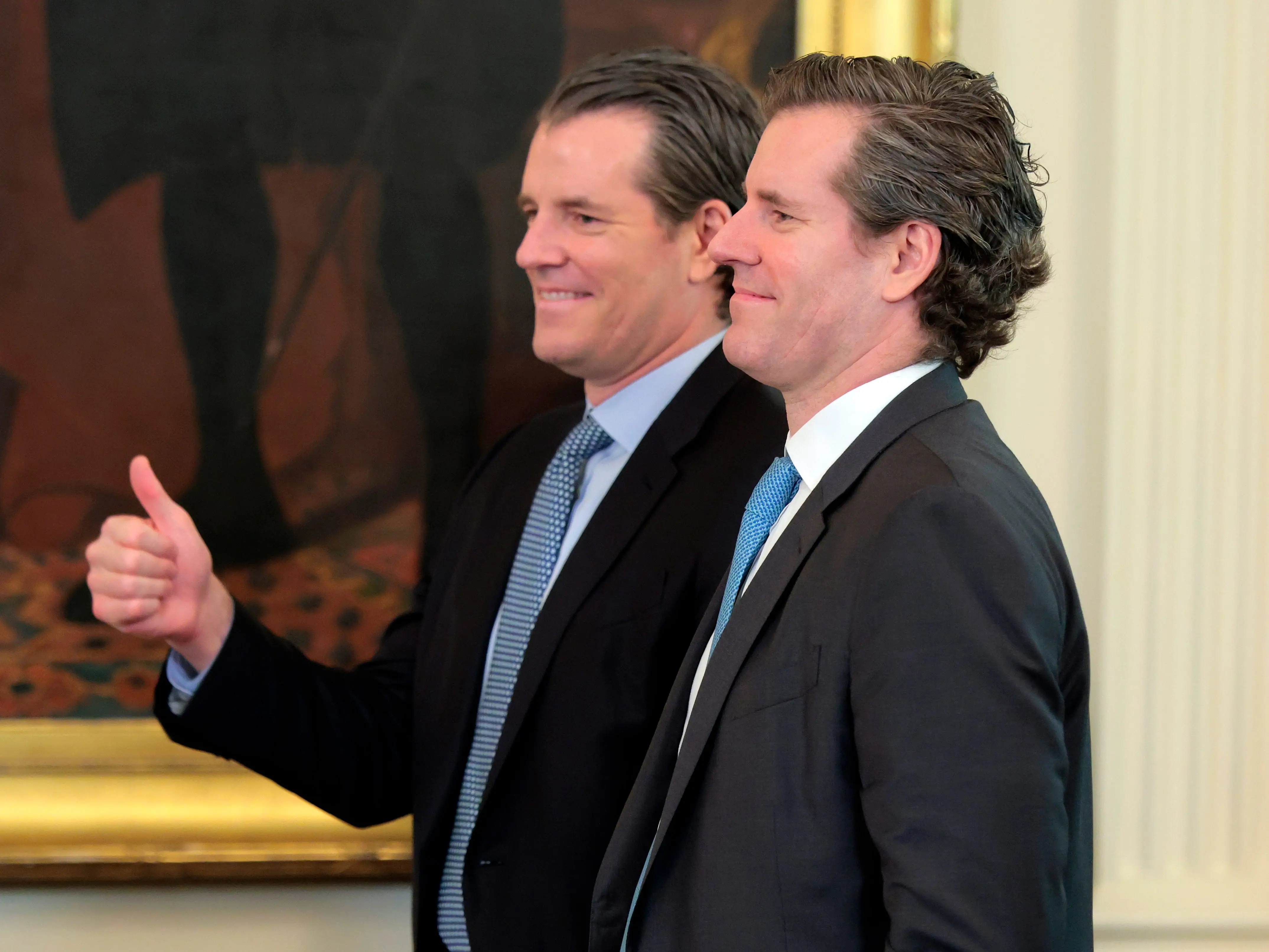 Tyler and Cameron Winklevoss attend an event at the White House