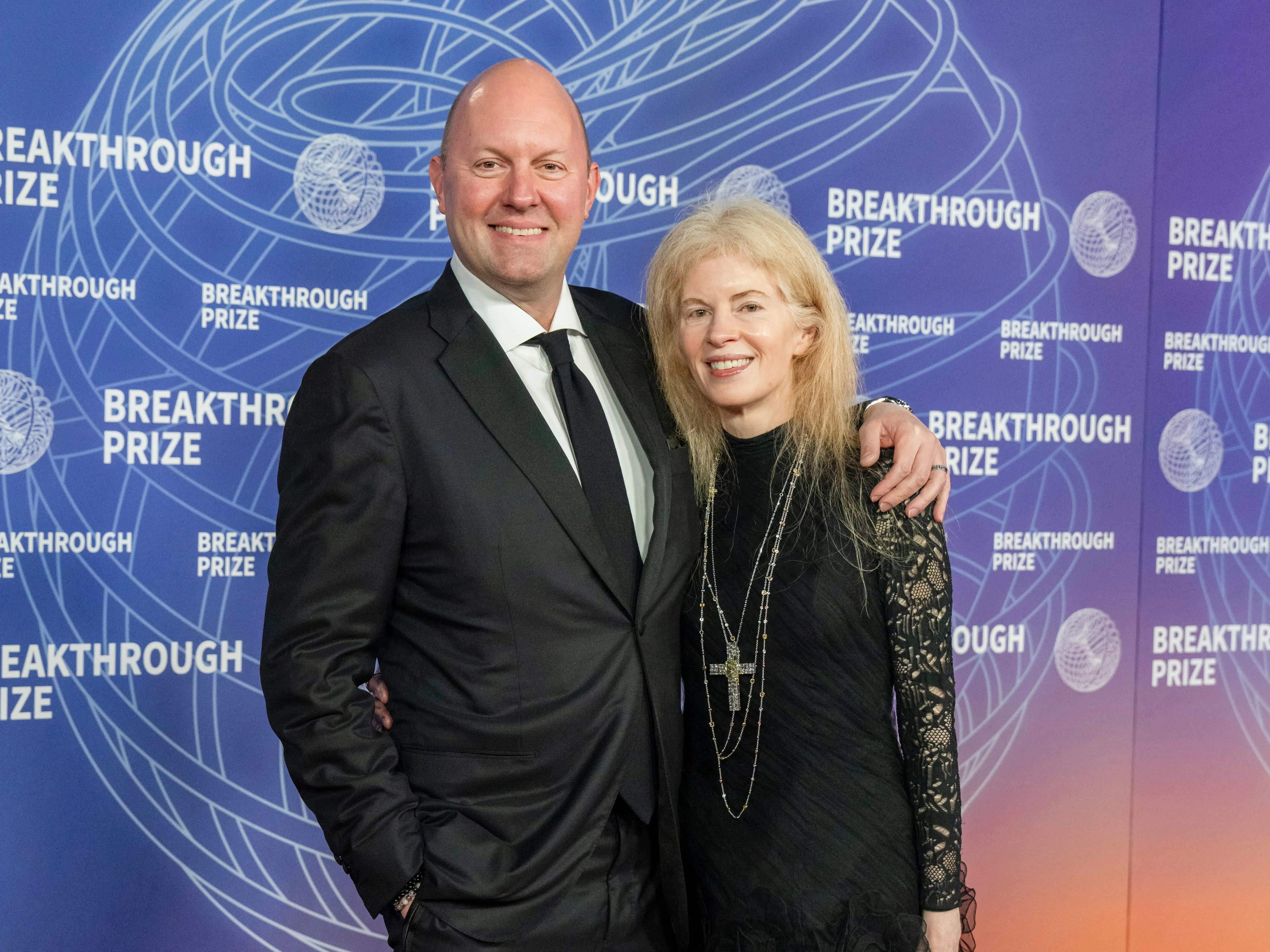 Marc and Laura Andreessen hug before an awards ceremony